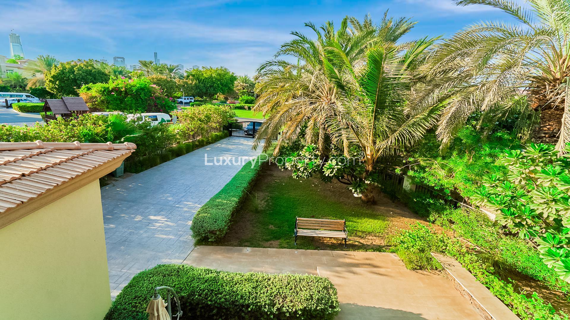 5-Bedroom Villa Exterior with Lush Garden in Jumeirah Islands, European Clusters