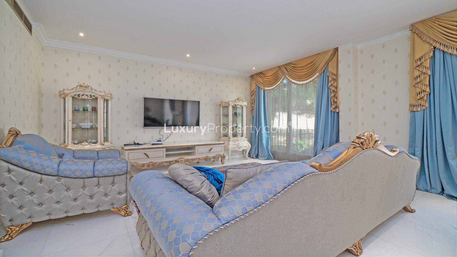 Luxurious living room in 5-bedroom villa, Jumeirah Islands, Dubai, elegant decor and furnishings