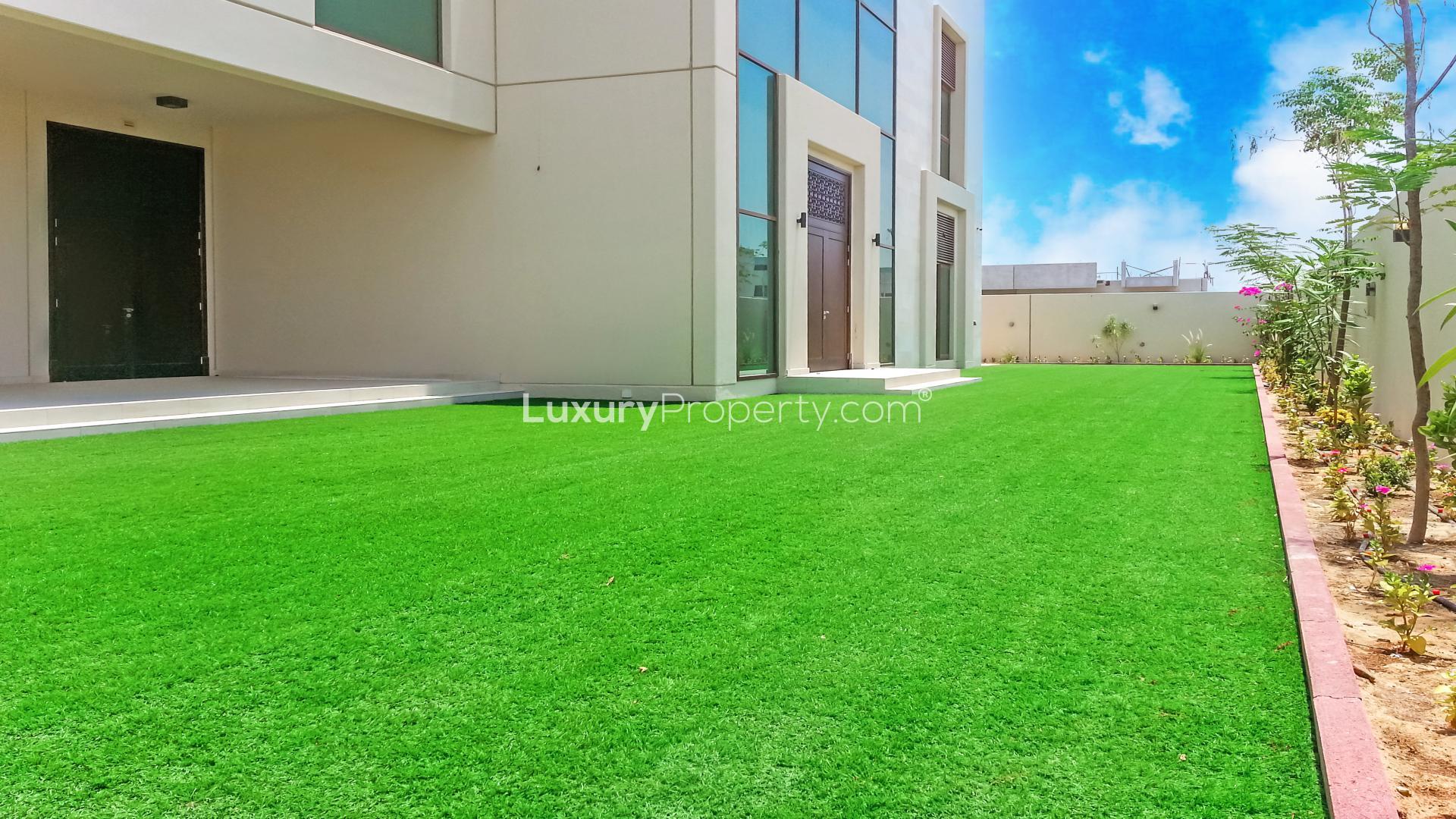Spacious garden of 5-bedroom villa in Meydan Gated Community, Dubai, for sale