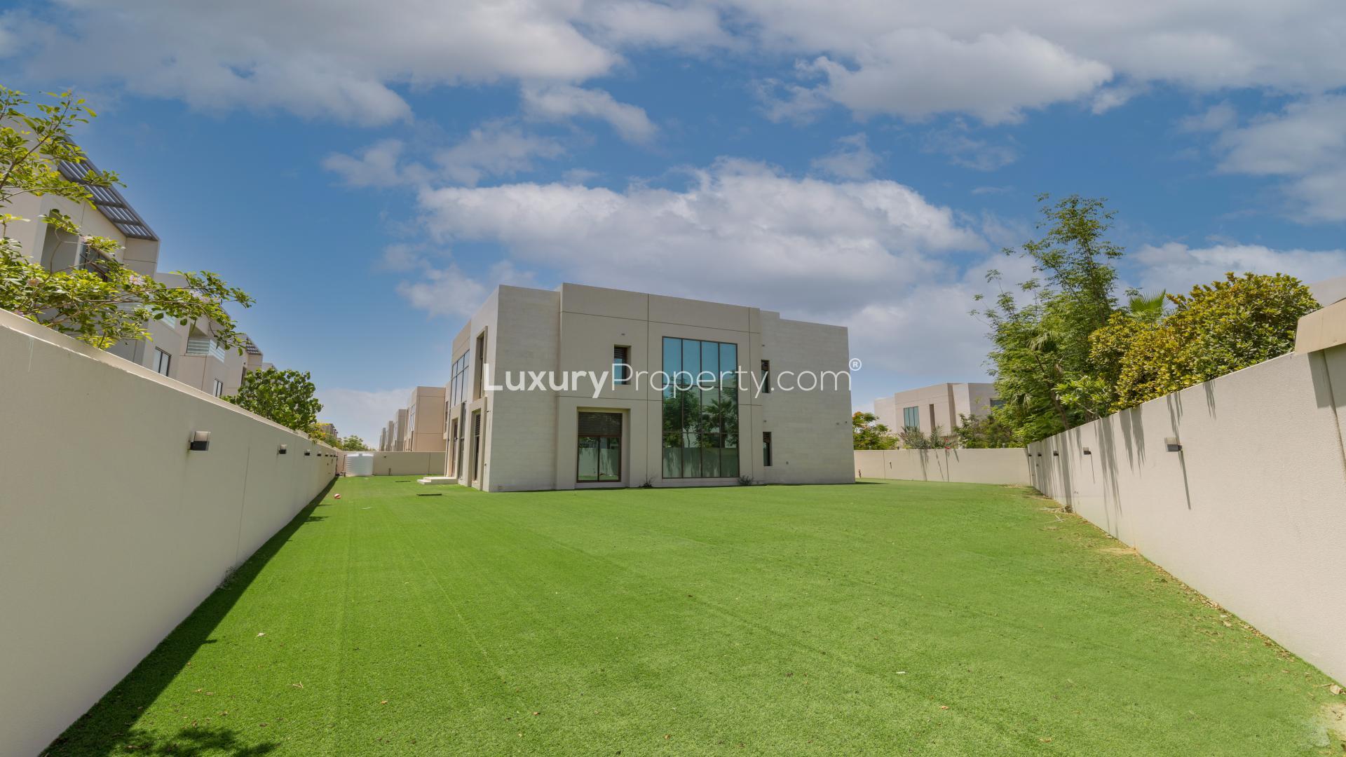 Corner villa with landscaped garden in Meydan Gated Community, featuring modern architecture