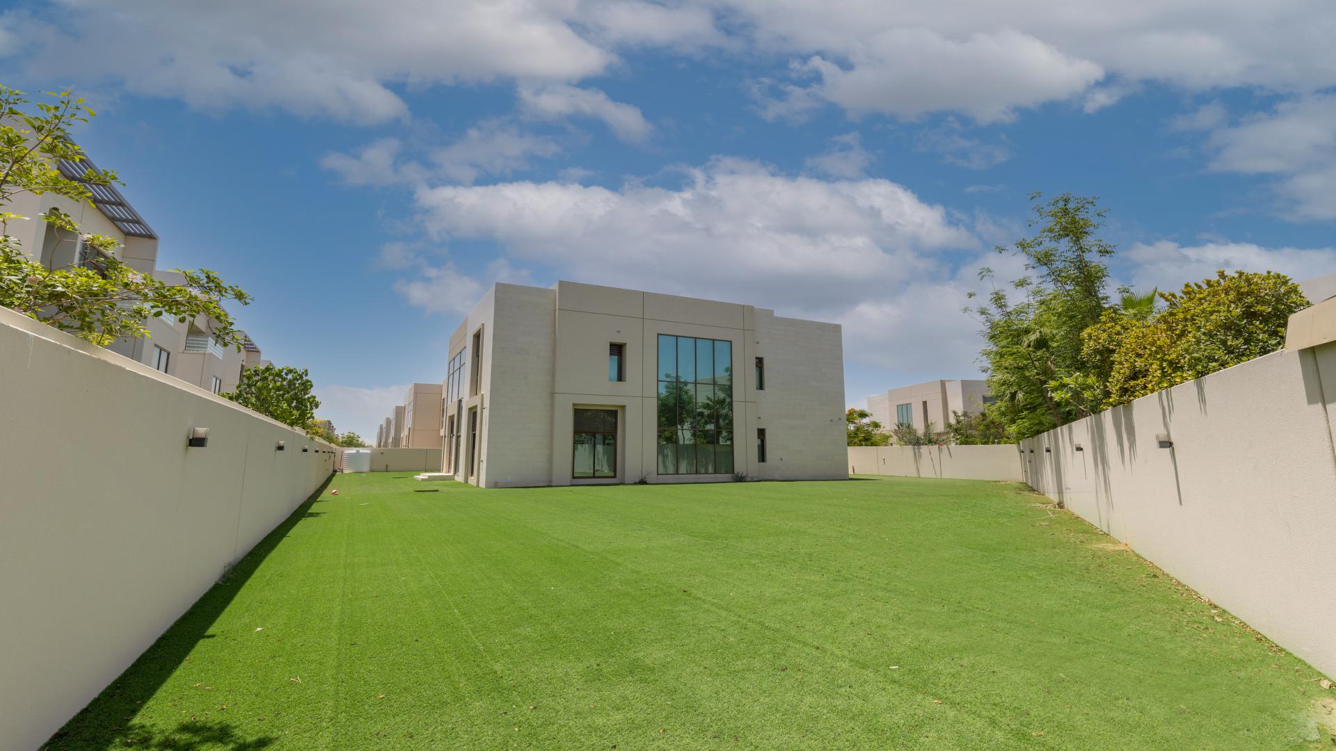 Corner villa with landscaped garden in Meydan Gated Community, featuring modern architecture