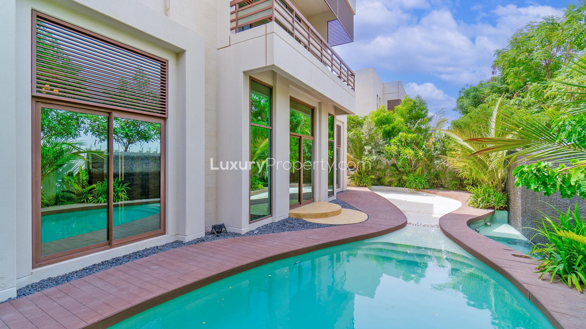 Stunning Meydan villa exterior with trees, showcasing luxury in gated community