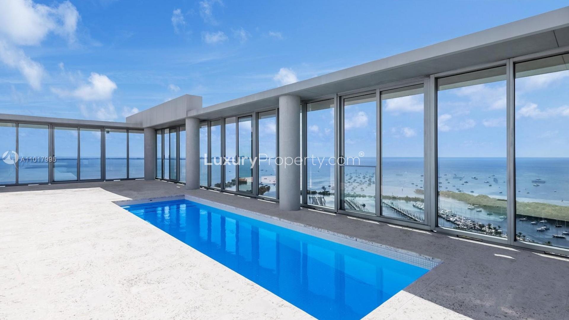 Full floor penthouse exterior view at 2675 S Bayshore Dr, Miami, overlooking marina