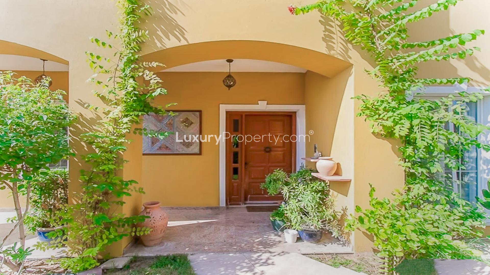 Front entrance of 5-bedroom villa in Mirador, Arabian Ranches with lush greenery