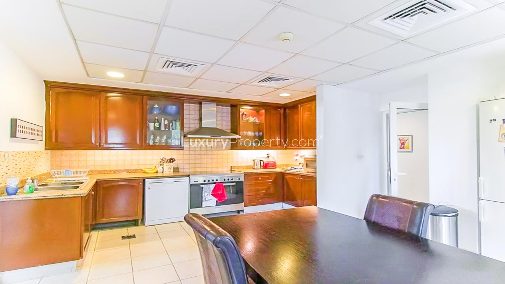 Kitchen in 5-bedroom villa for sale in Mirador, Arabian Ranches, featuring modern appliances