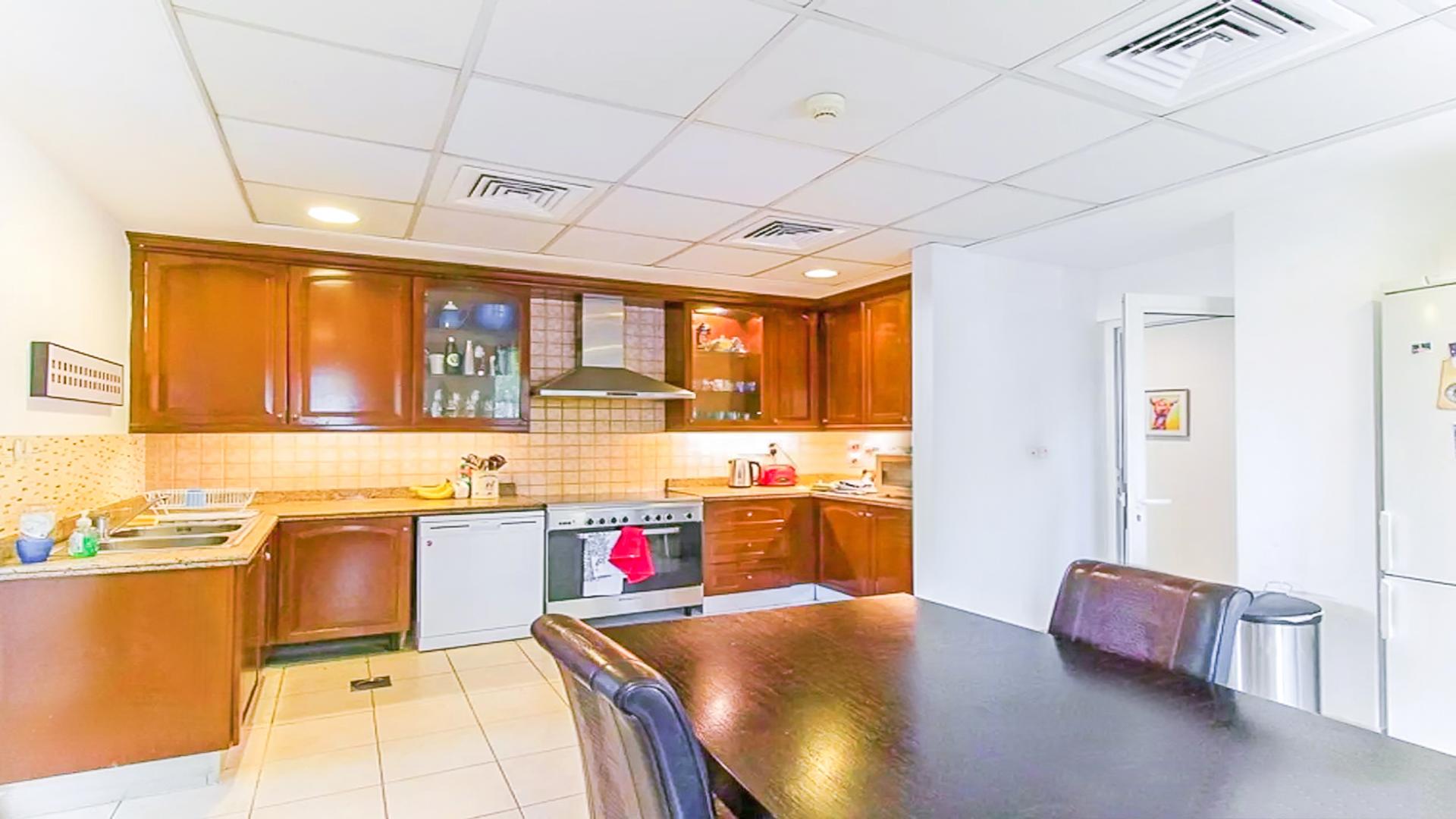 Kitchen in 5-bedroom villa for sale in Mirador, Arabian Ranches, featuring modern appliances