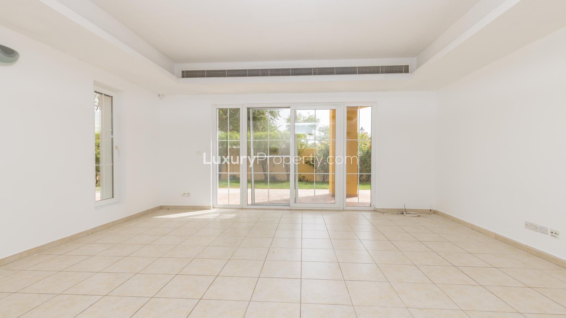 "Luxury villa with pool and gazebo in Mirador, Arabian Ranches, for sale.",Spacious living room with large windows in Mirador villa, Arabian Ranches for sale