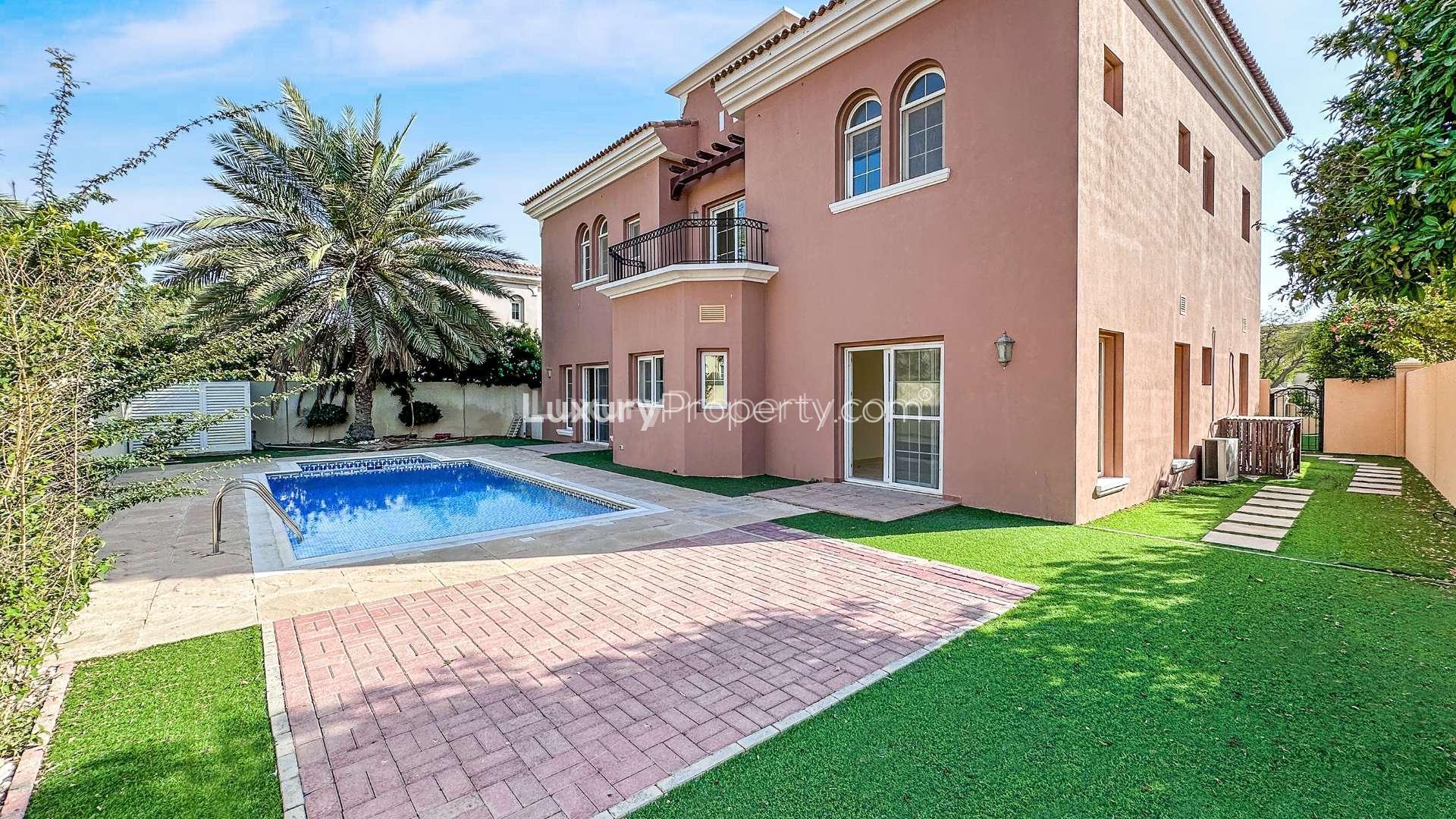Spacious living room in 5-bedroom Mirador Villa, Arabian Ranches, Dubai, with large windows