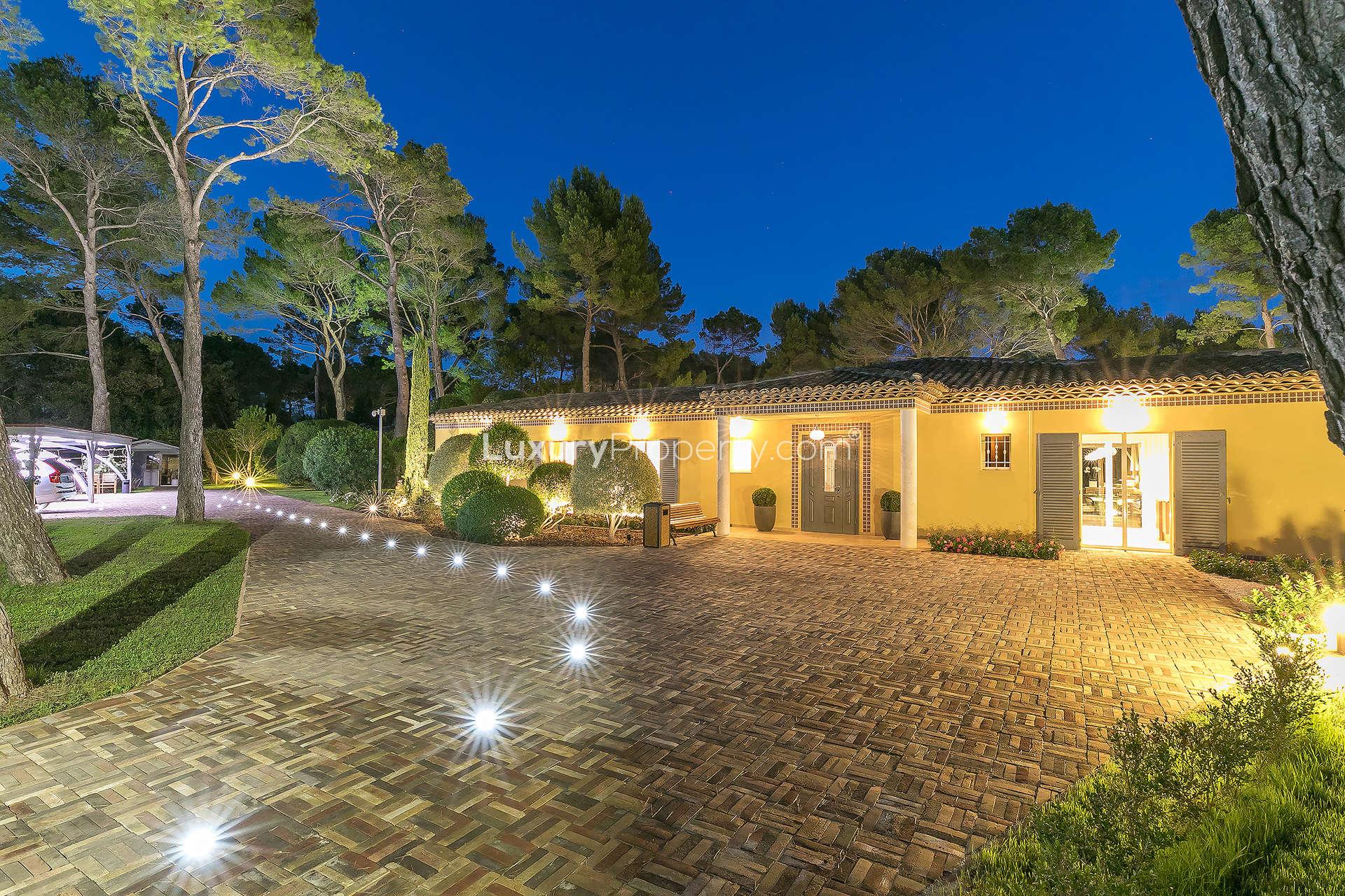 Outdoor seating area overlooking pool at luxury villa in Mougins, French Riviera