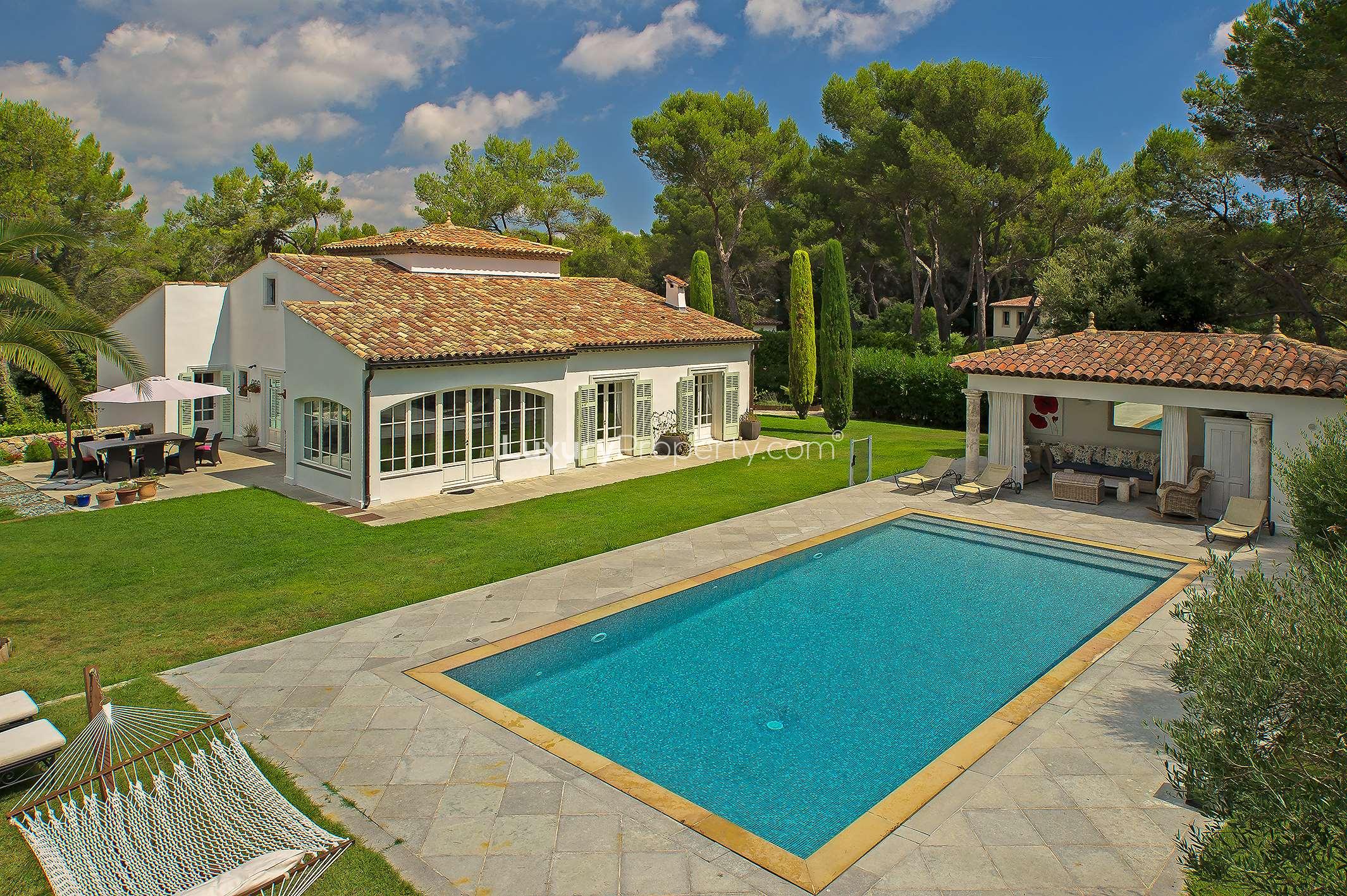 Luxurious villa with pool in Mougins, French Riviera, surrounded by lush greenery