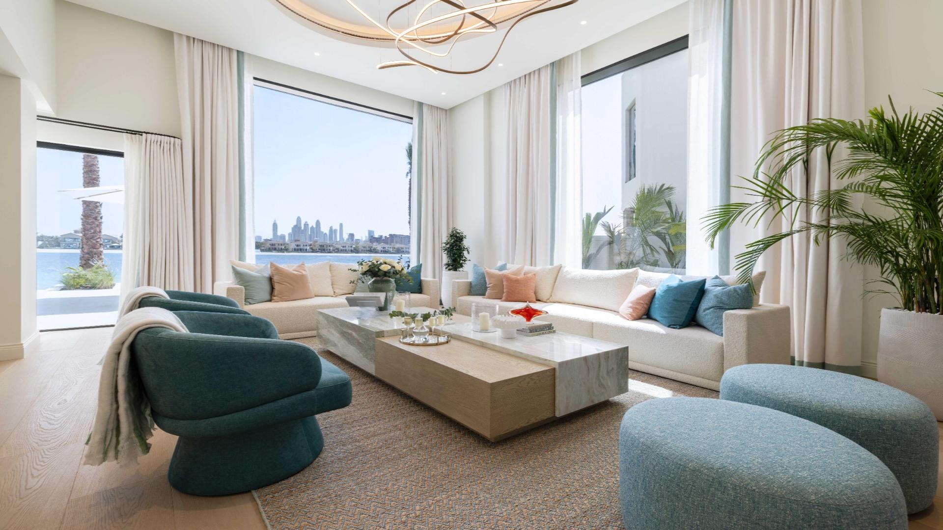 Exquisite 5-bedroom renovated villa exterior on Palm Jumeirah, featuring modern design and luxury car