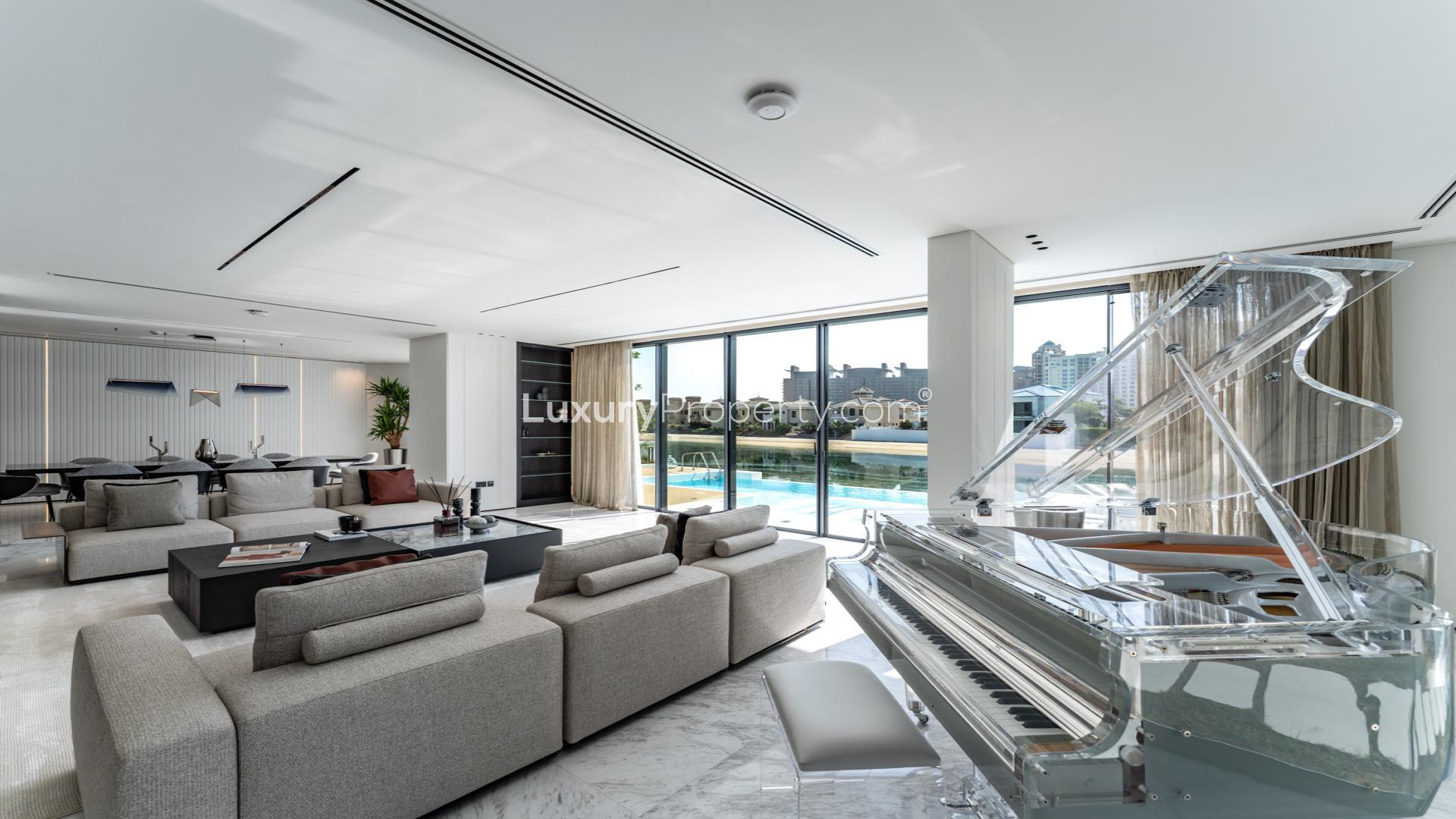 Outdoor pool and beach view at luxury Palm Jumeirah villa for sale, Garden Homes