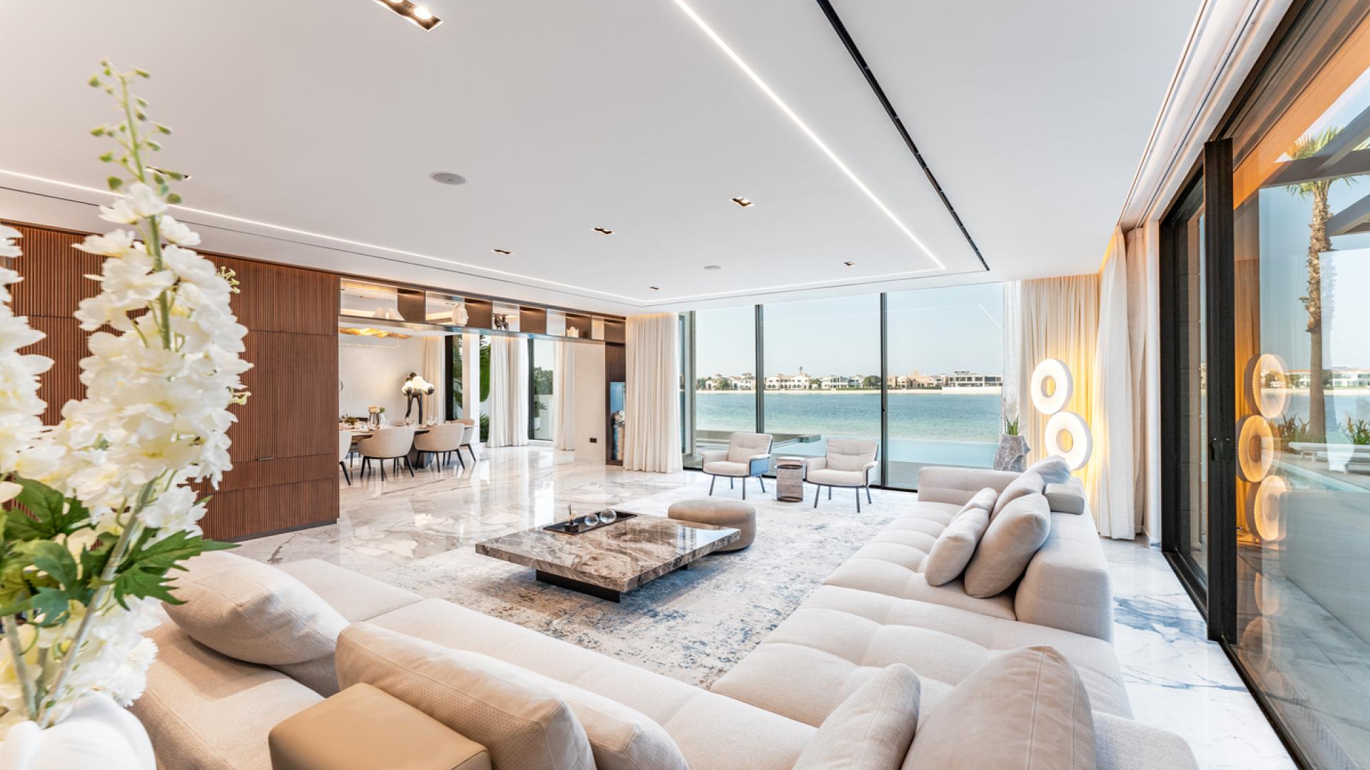 N/A,Luxurious living room with sea views in Palm Jumeirah villa, featuring elegant decor