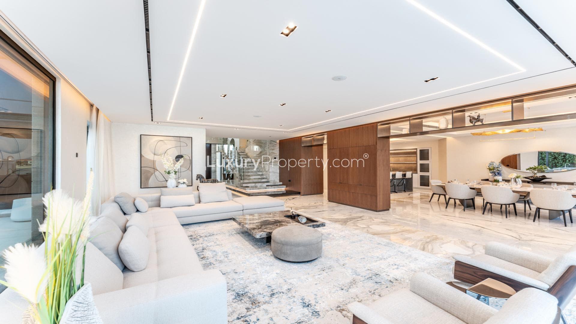 Luxury villa with illuminated pool and modern patio in Palm Jumeirah, Garden Homes