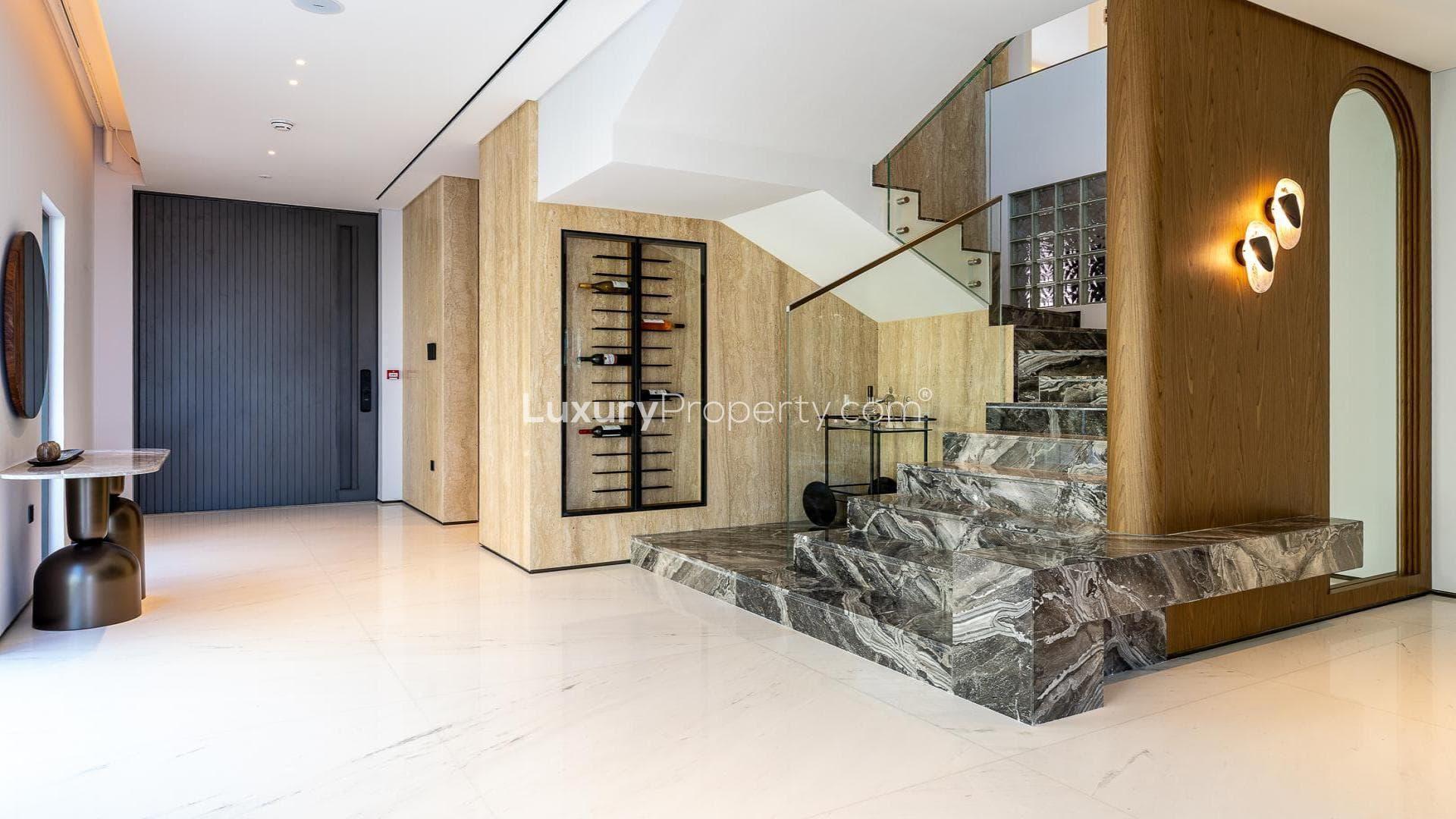 Modern villa exterior with luxury car, Palm Jumeirah, Garden Homes. 5-bed, 7-bath for sale