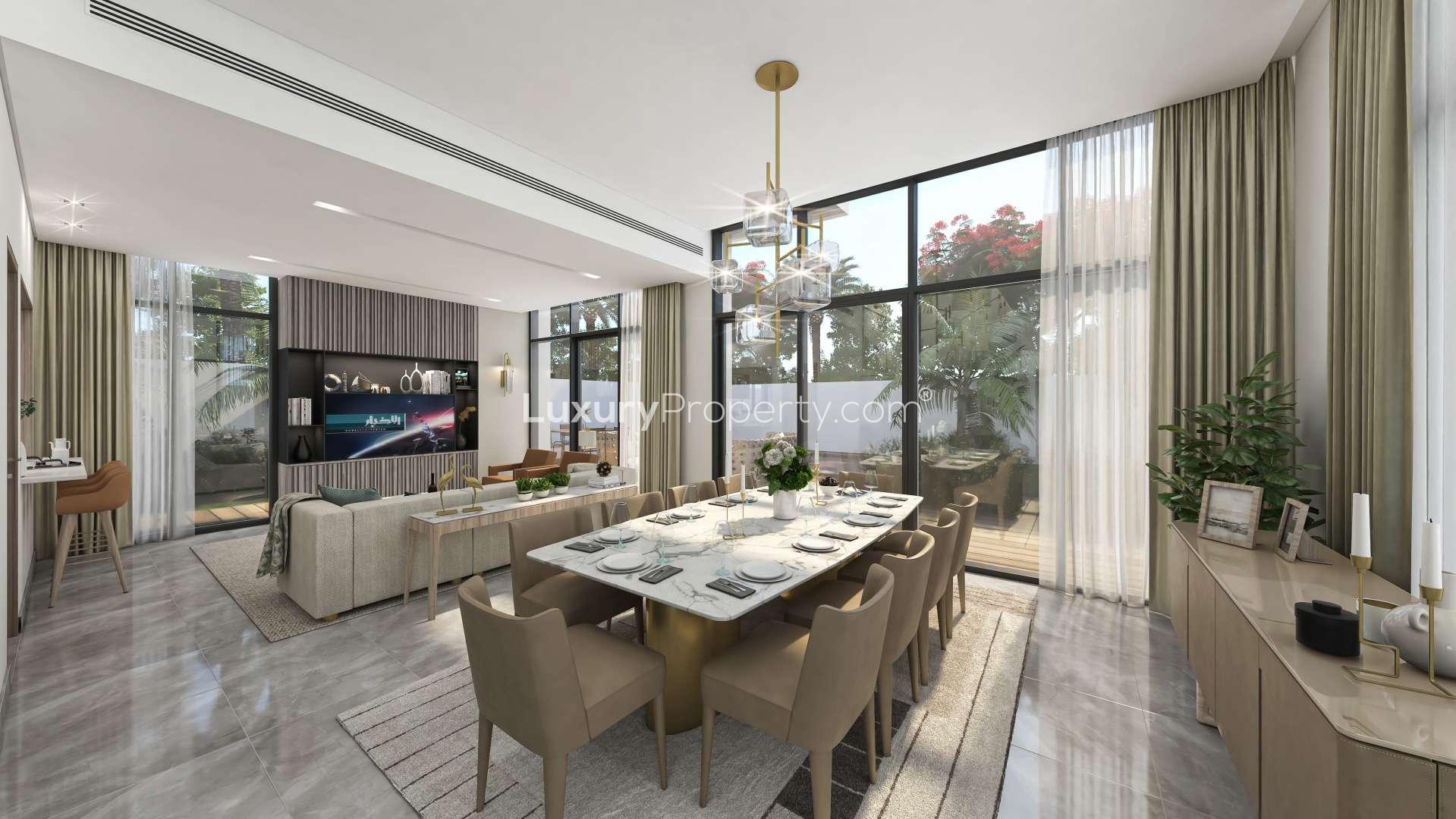 Luxurious modern villa exterior in Murooj Al Furjan with tropical landscaping and parked cars