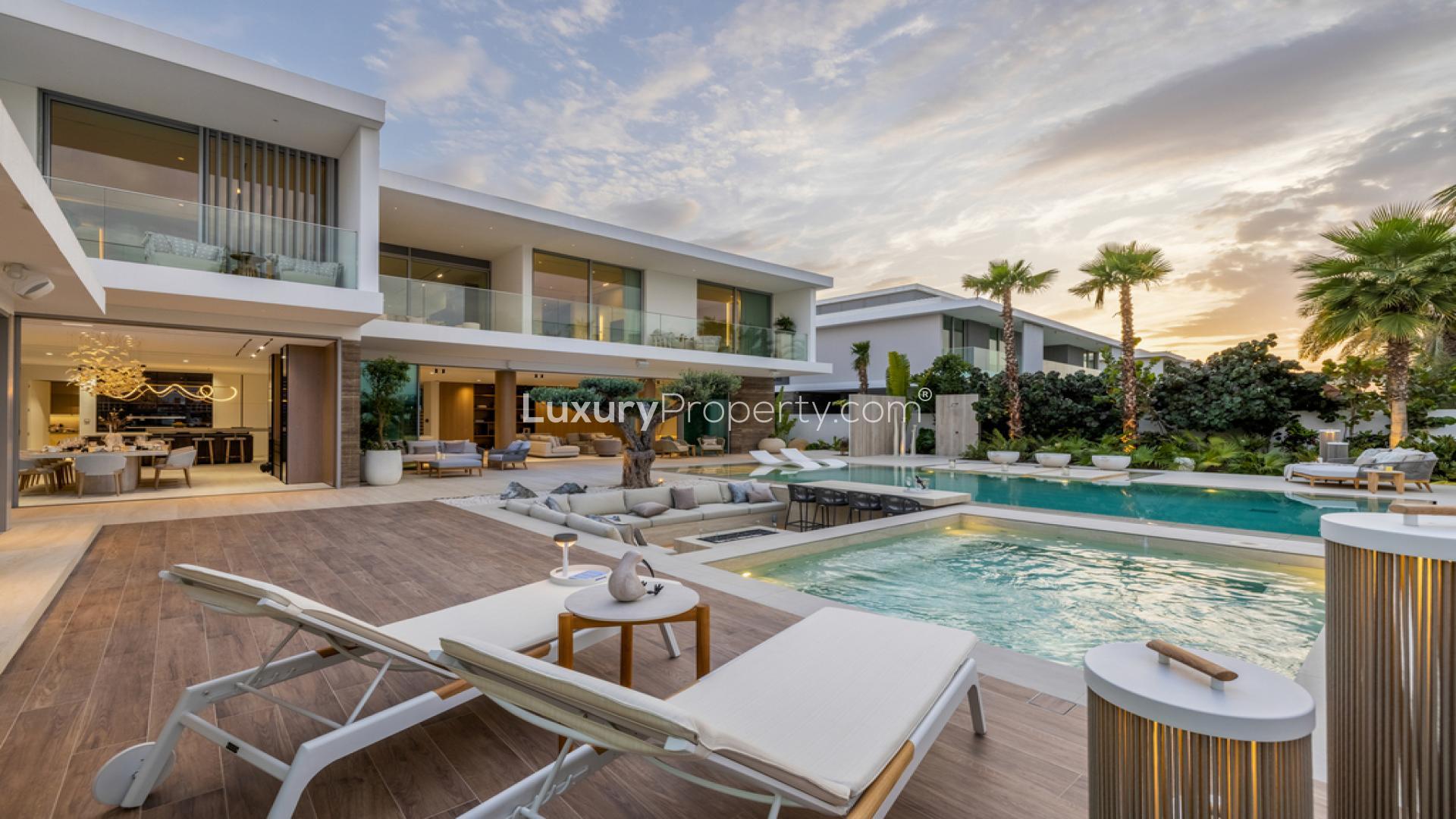Ultra-luxury villa with pool at night, Dubai Hills Estate, for sale
