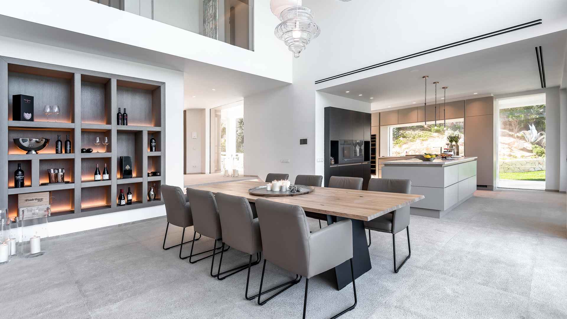Contemporary villa dining area with modern fireplace in Nova Santa Ponca, Mallorca