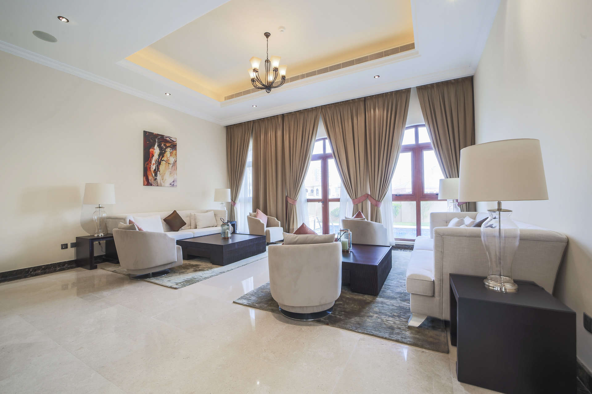 "Stunning 5-bedroom Mediterranean villa for sale in Orange Lake, Jumeirah Golf Estates.",Luxurious living room in Mediterranean villa, Orange Lake, Jumeirah Golf Estates, modern decor