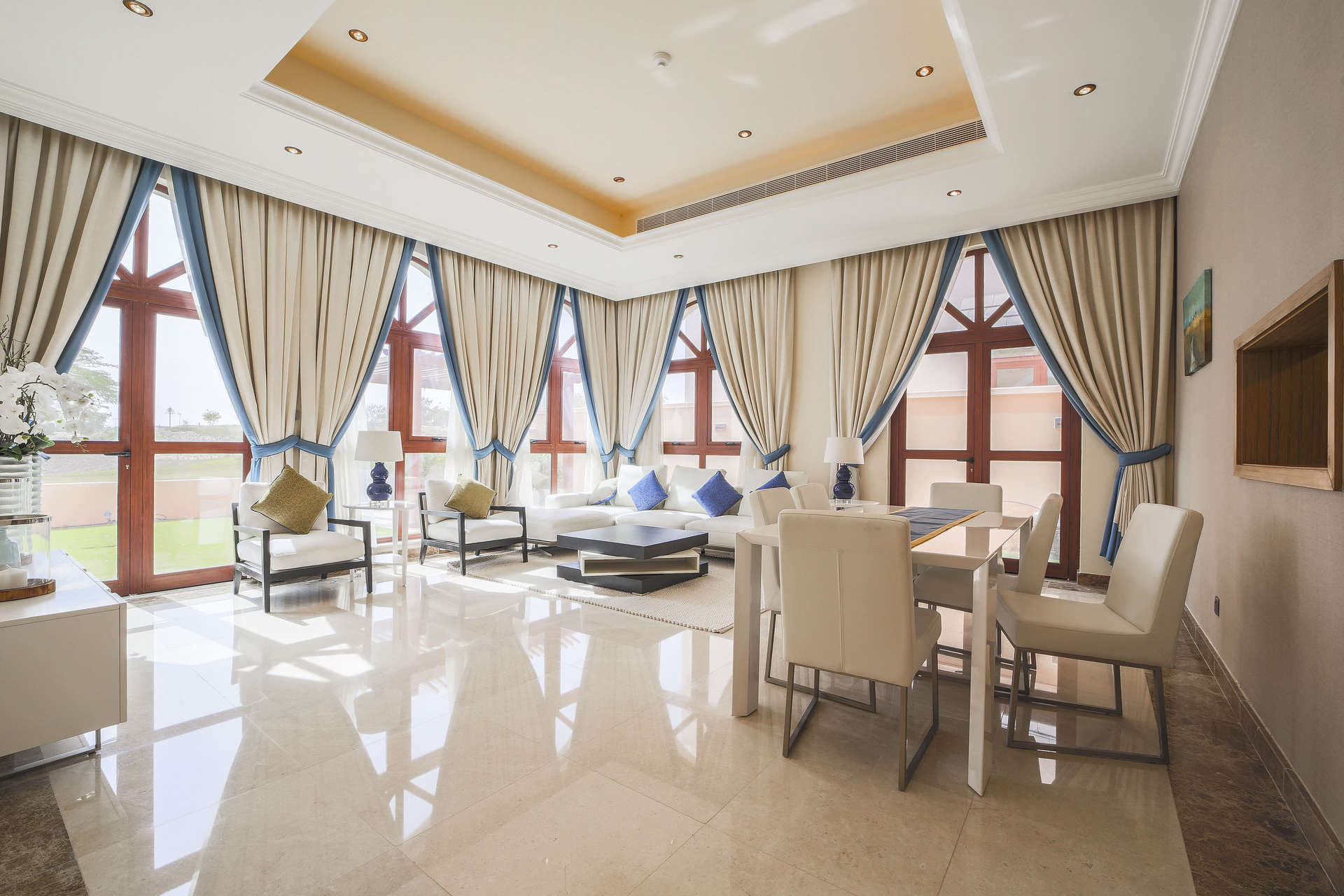 Luxurious bedroom in Jumeirah Golf Estates villa with elegant decor and large windows