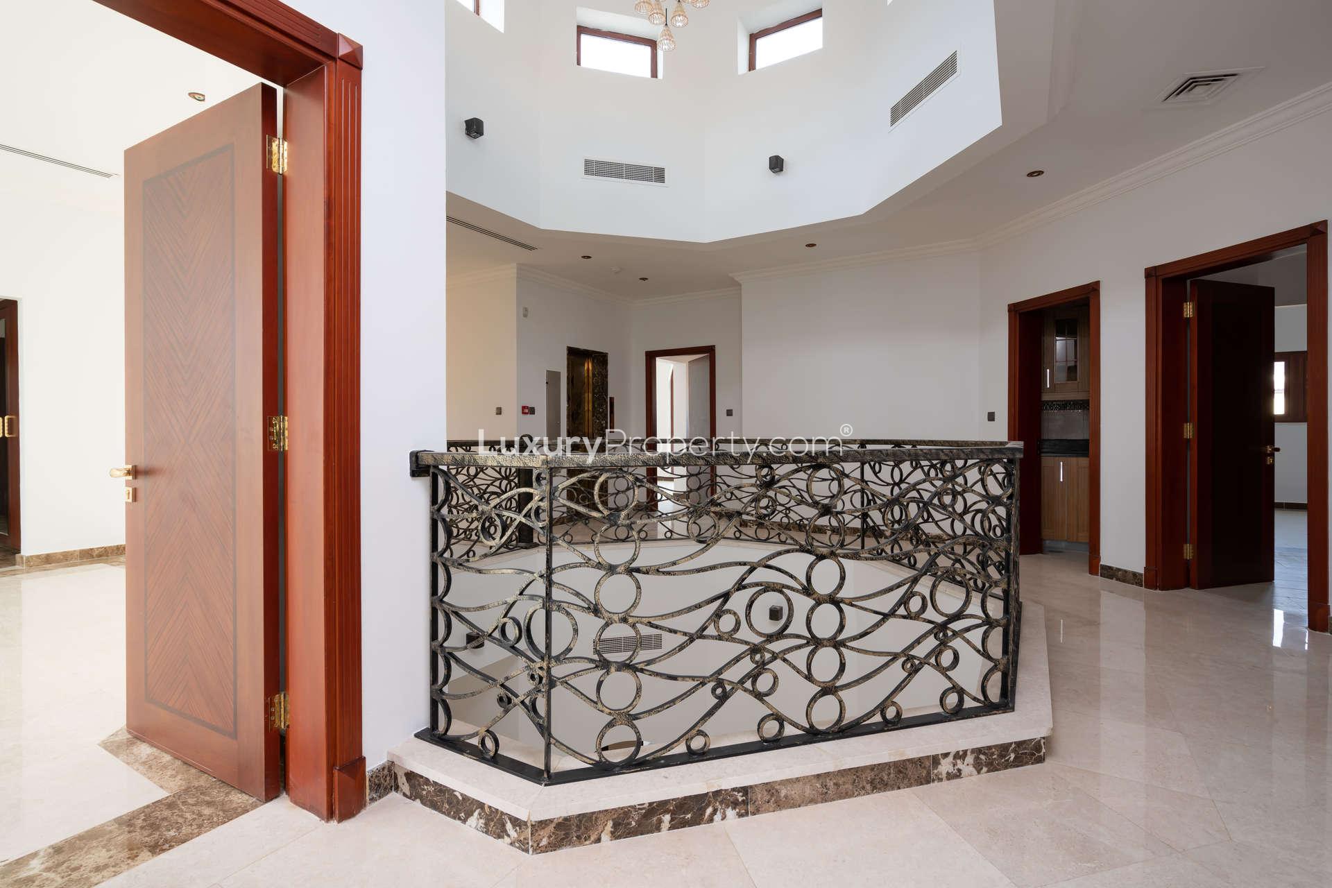 Luxurious hallway with wooden closets in Jumeirah Golf Estates villa for sale