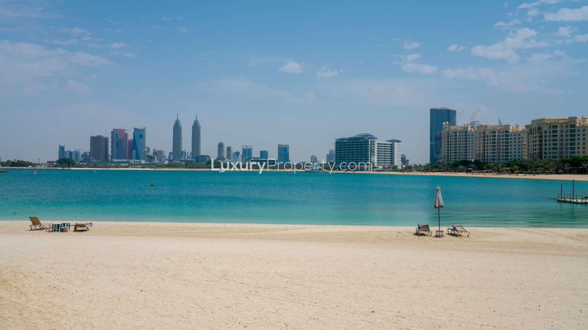 Beachfront view from Palma Residences townhouse, Palm Jumeirah, showcasing serene sea and skyline