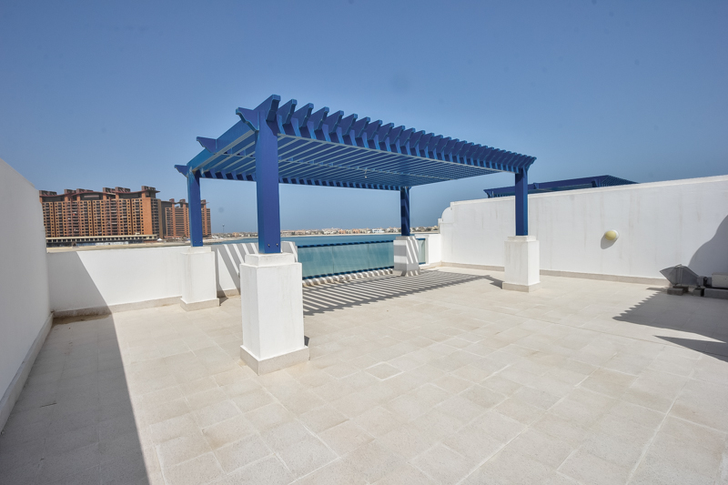 Empty bedroom with wooden closets in Palma Residences villa, Palm Jumeirah