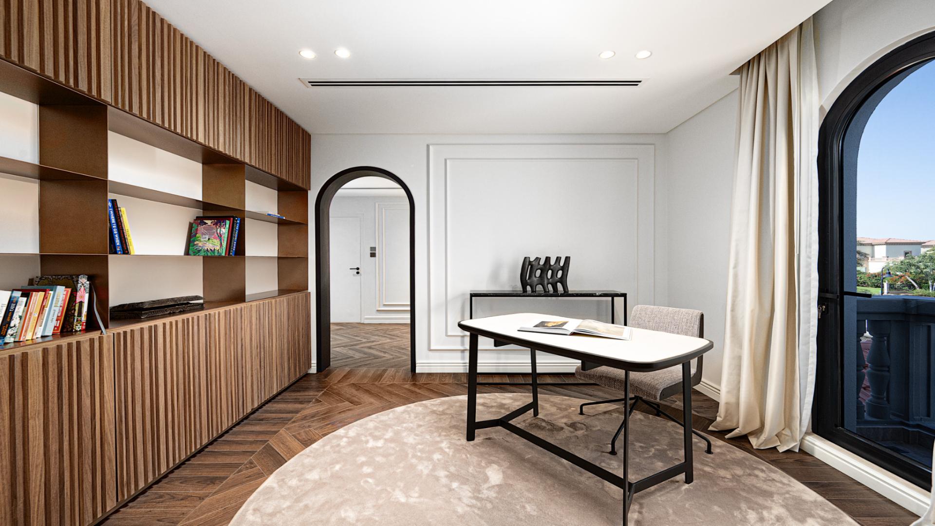 Modern study room in Jumeirah Islands villa, featuring elegant wood paneling and natural light