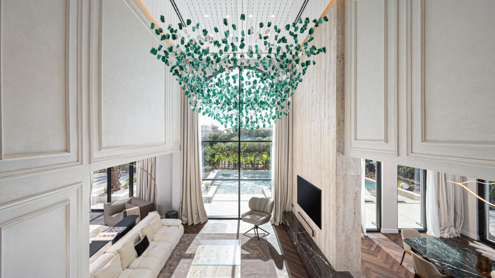 Luxurious home office in Jumeirah Islands villa with elegant furnishings and built-in shelves