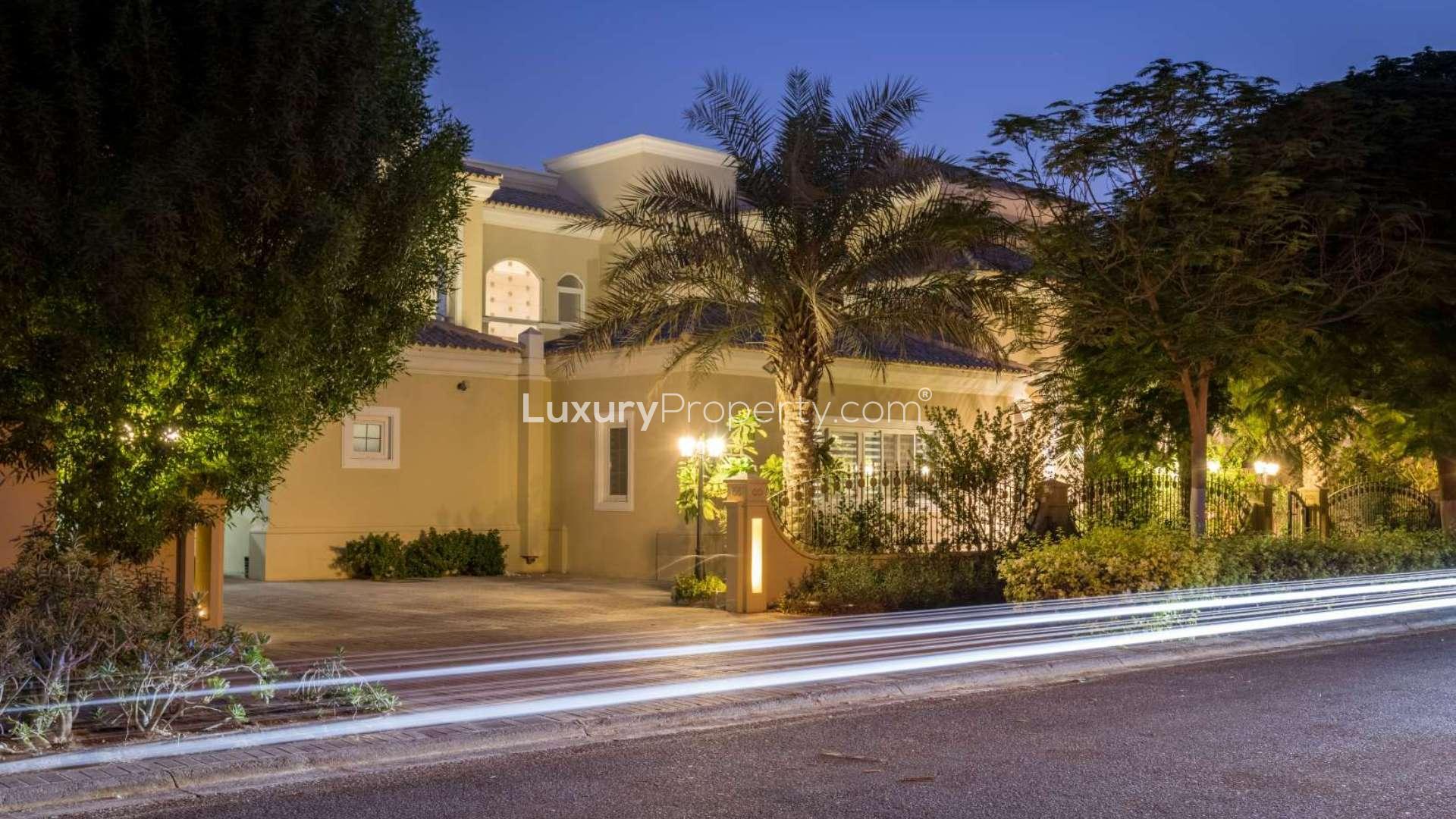 Luxurious 5-bedroom villa exterior at night in Arabian Ranches, Polo Homes community