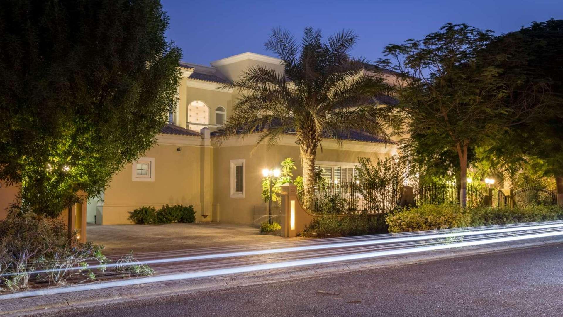 Luxurious 5-bedroom villa exterior at night in Arabian Ranches, Polo Homes community