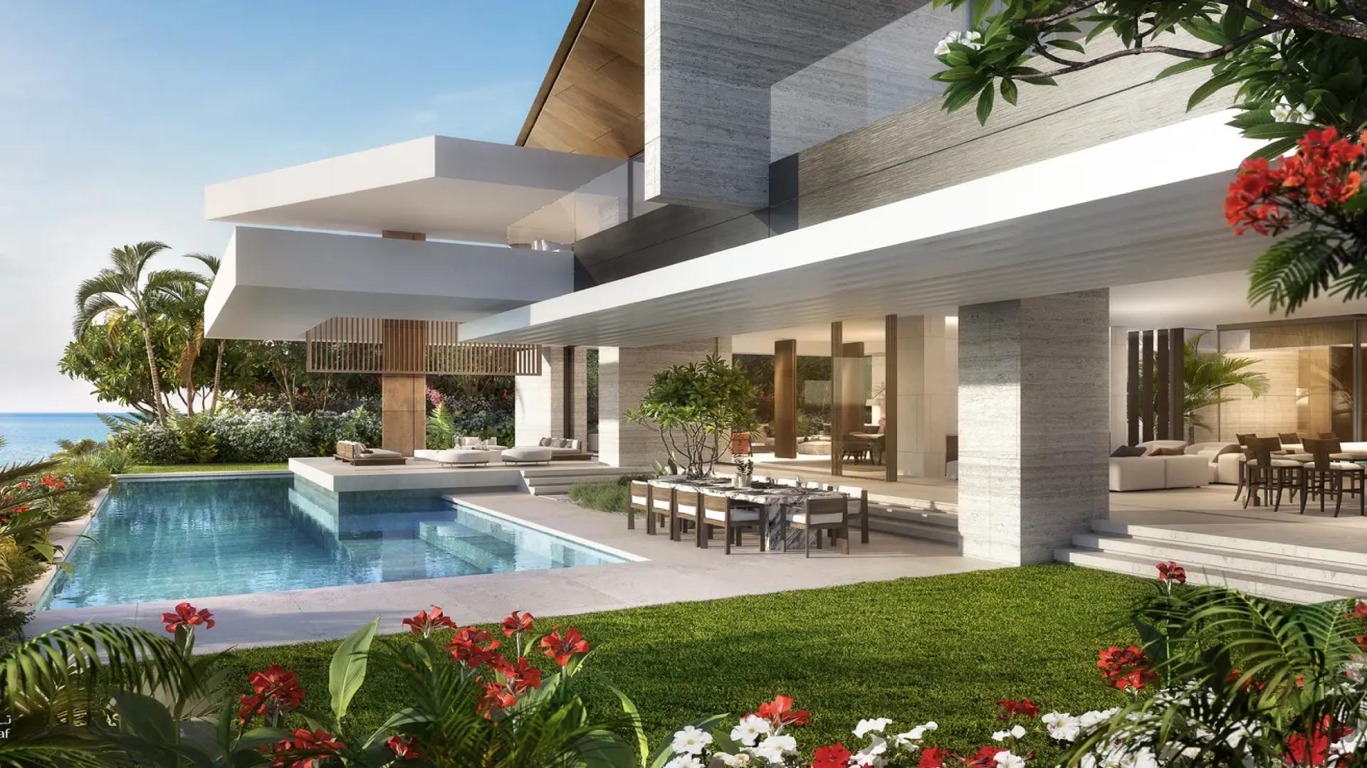 Luxurious 5-bedroom villa with pool in Tilal Al Ghaf's Serenity Mansions at dusk