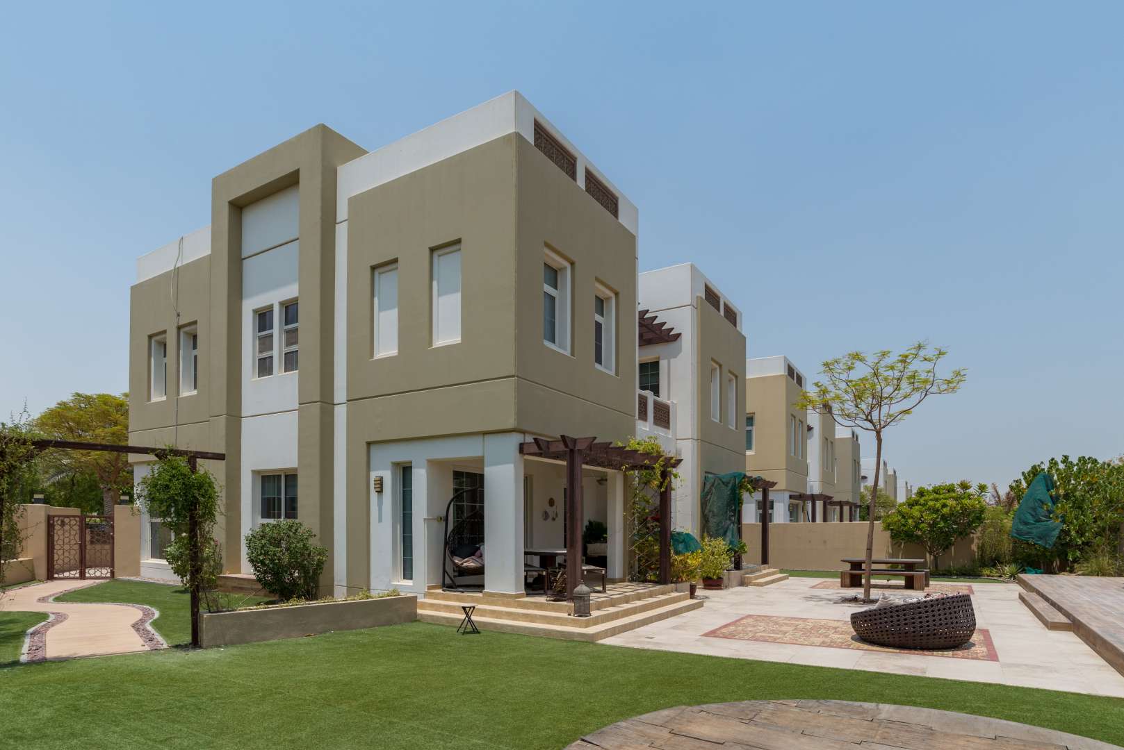 Spacious 5-bedroom villa exterior with garden in Rahat, Mudon, available for sale