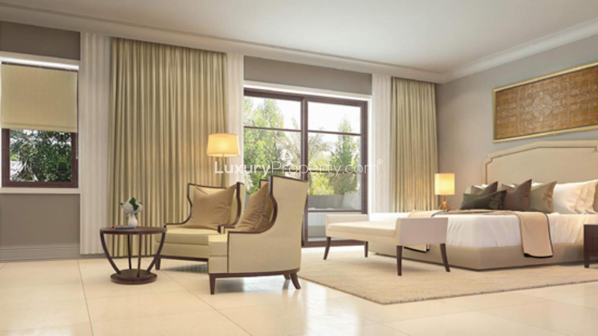 Luxurious bedroom in 5-bedroom Rasha Villa, Arabian Ranches 2, with elegant decor and seating