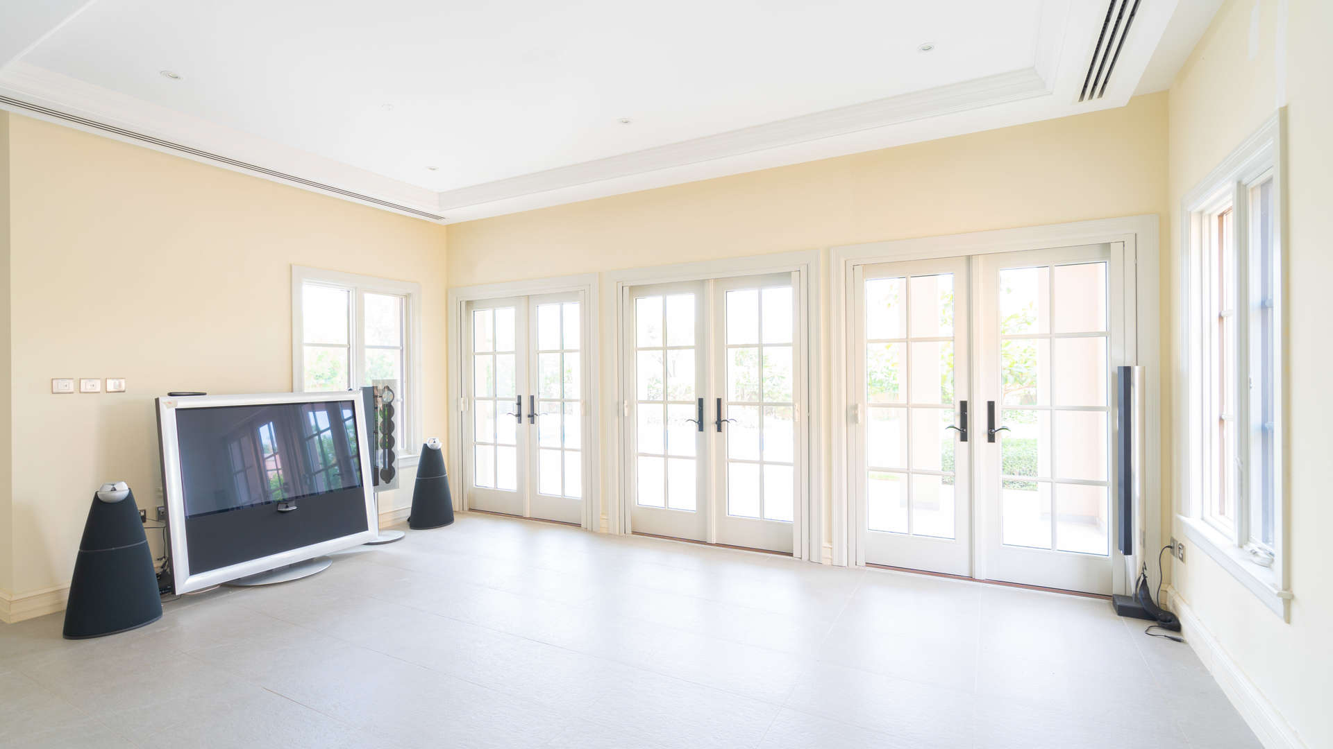 Luxurious villa living room with large windows, Jumeirah Golf Estates, for sale