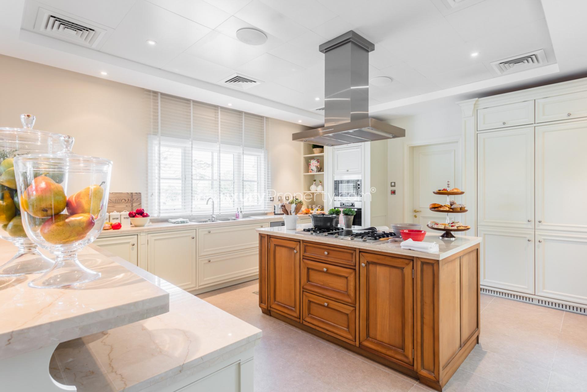 Luxurious kitchen in 5-bedroom villa, Jumeirah Golf Estates, Dubai. Spacious island, modern design