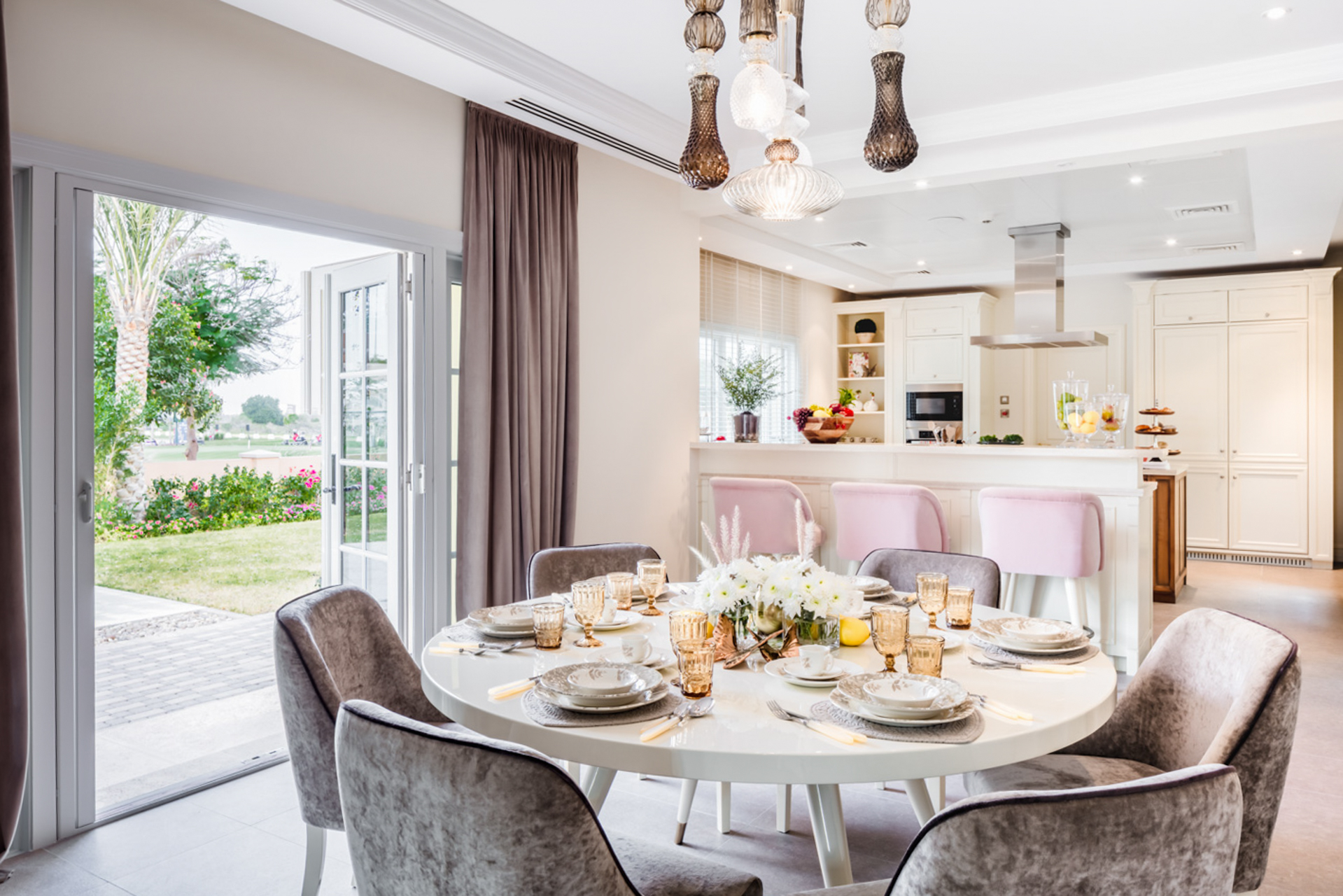 "Elegant dining room in luxury villa, Jumeirah Golf Estates, Dubai with garden views.",Luxury dining area in a 5-bedroom villa, Jumeirah Golf Estates, Dubai