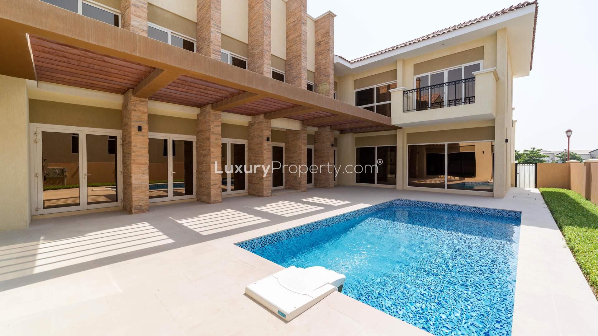 "Spacious villa patio with pergola and garden view in Jumeirah Golf Estates, Fire community.",Luxurious villa with private pool in Jumeirah Golf Estates, Fire community, for sale