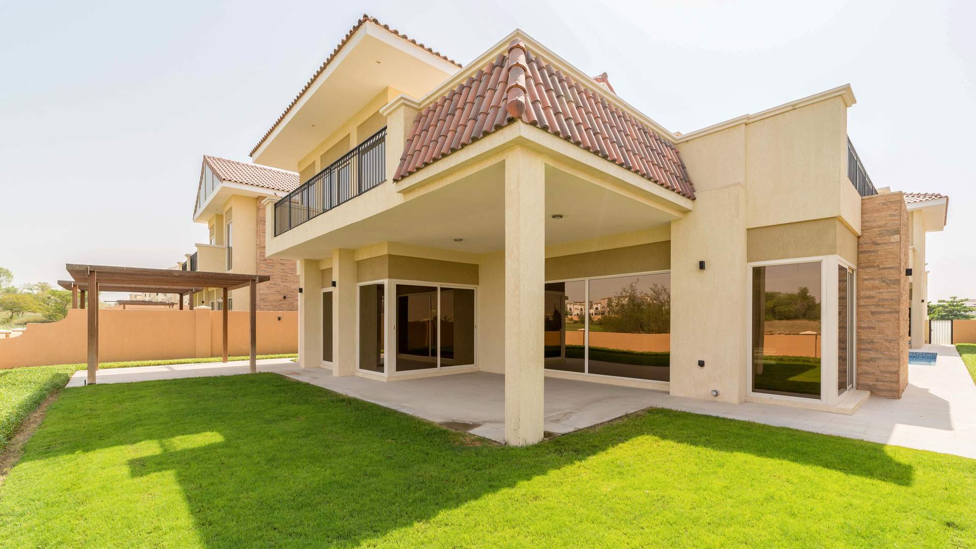 Luxurious living room in five-bedroom villa, Jumeirah Golf Estates, with golf course view