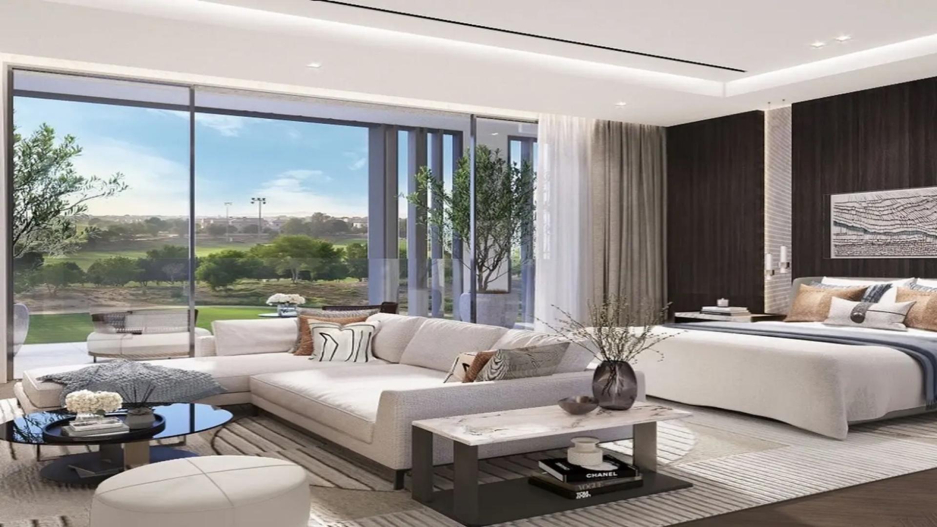 Luxurious living room and dining area in Jumeirah Golf Estates villa, modern design