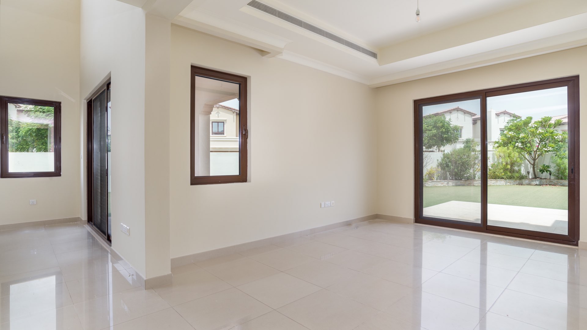 Bright living room with garden view in Rosa villa, Arabian Ranches 2