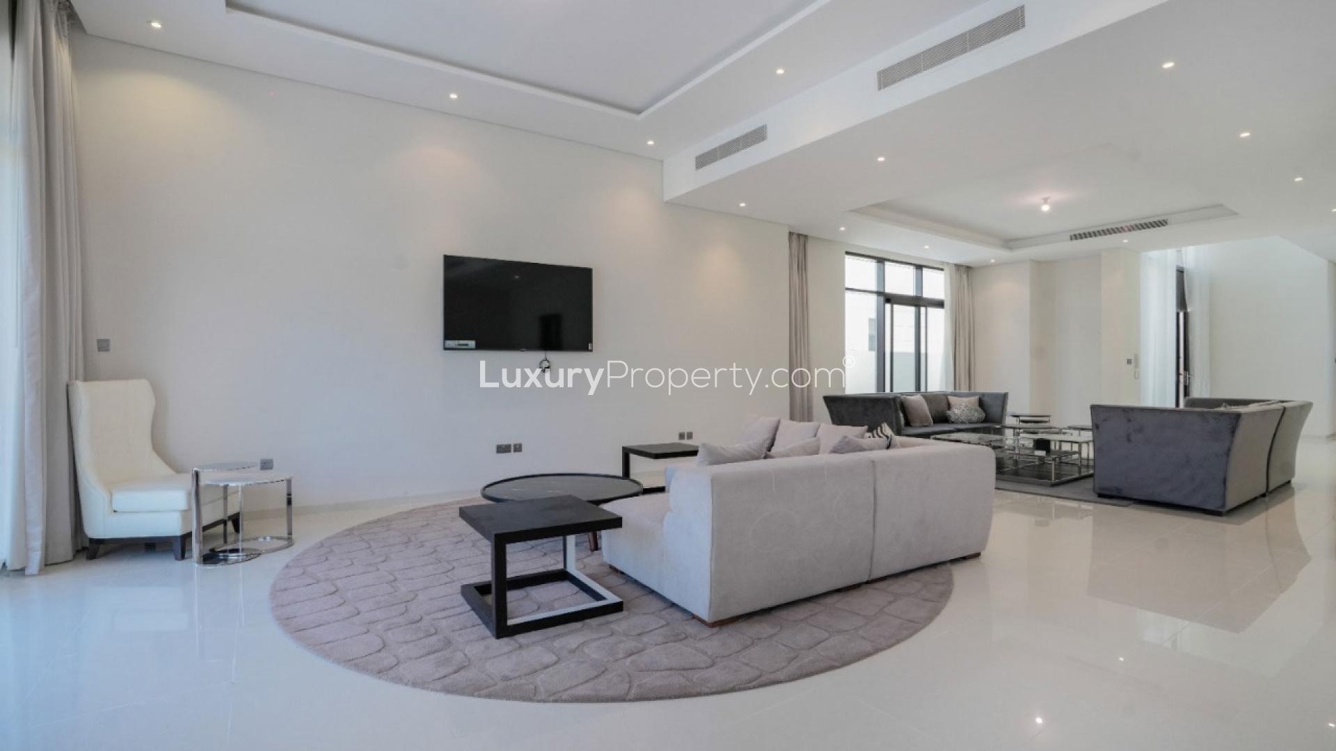 Spacious dining area in 5-bedroom villa, The Field, DAMAC Hills, with modern decor