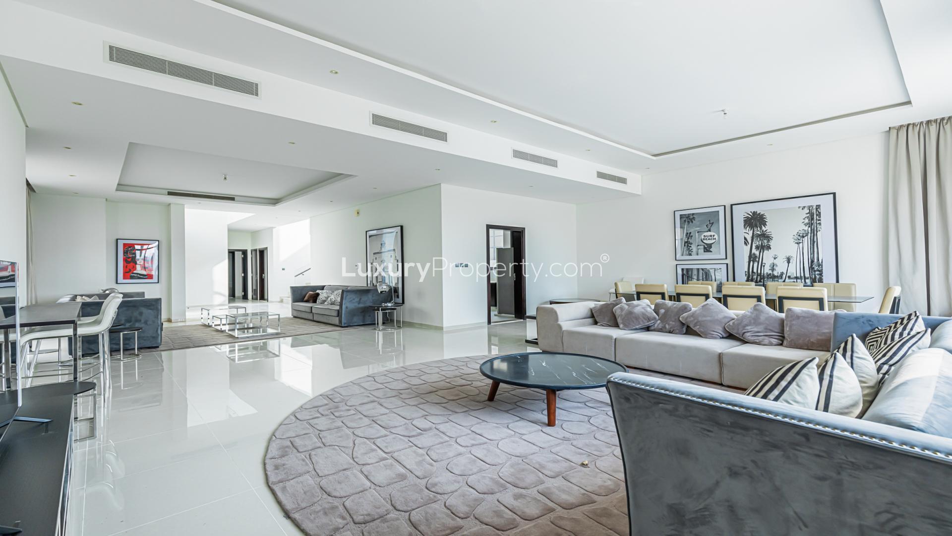 Spacious living and dining area in fully furnished golf-facing villa, Damac Hills, Flora