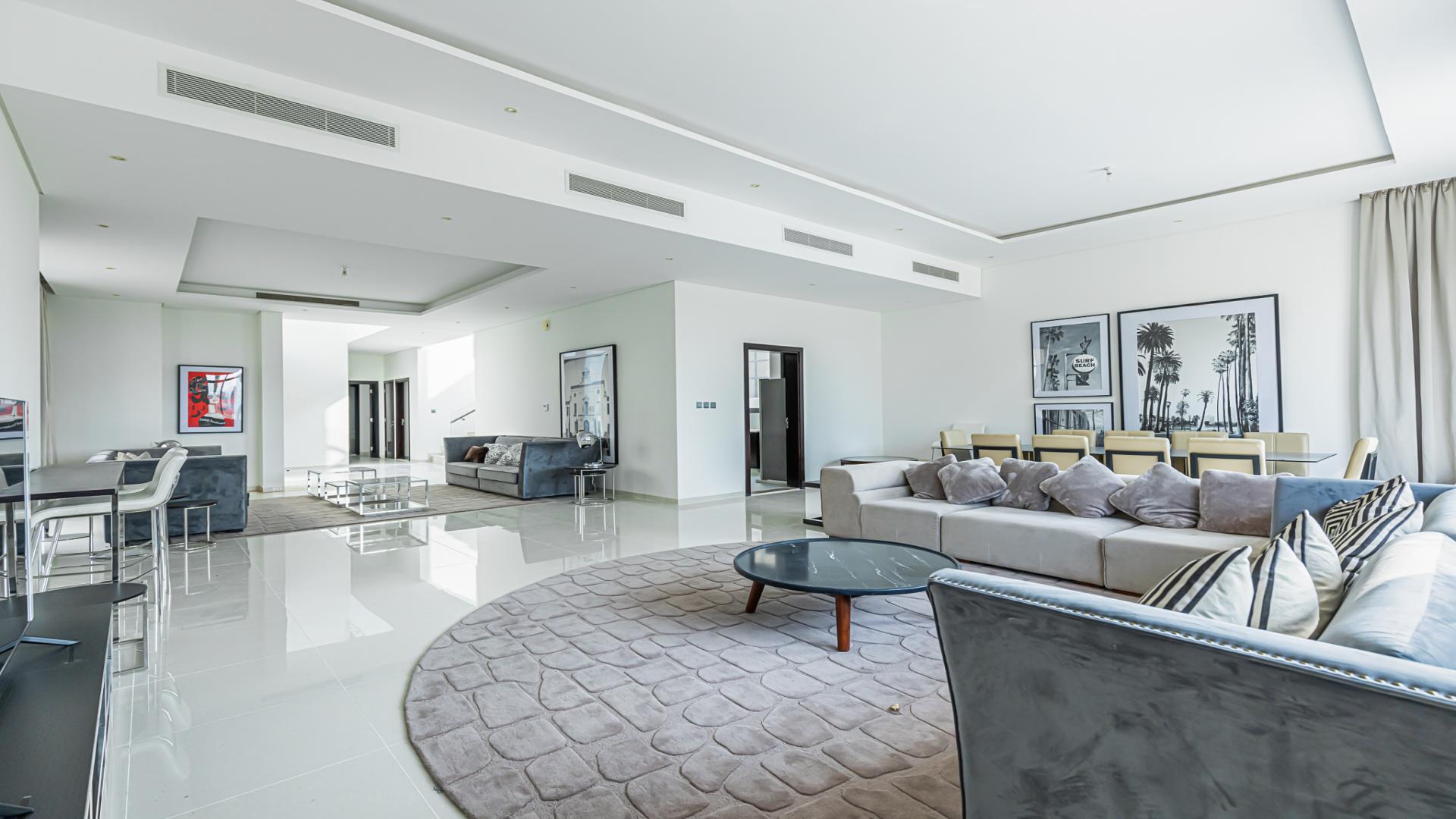 Spacious living and dining area in fully furnished golf-facing villa, Damac Hills, Flora