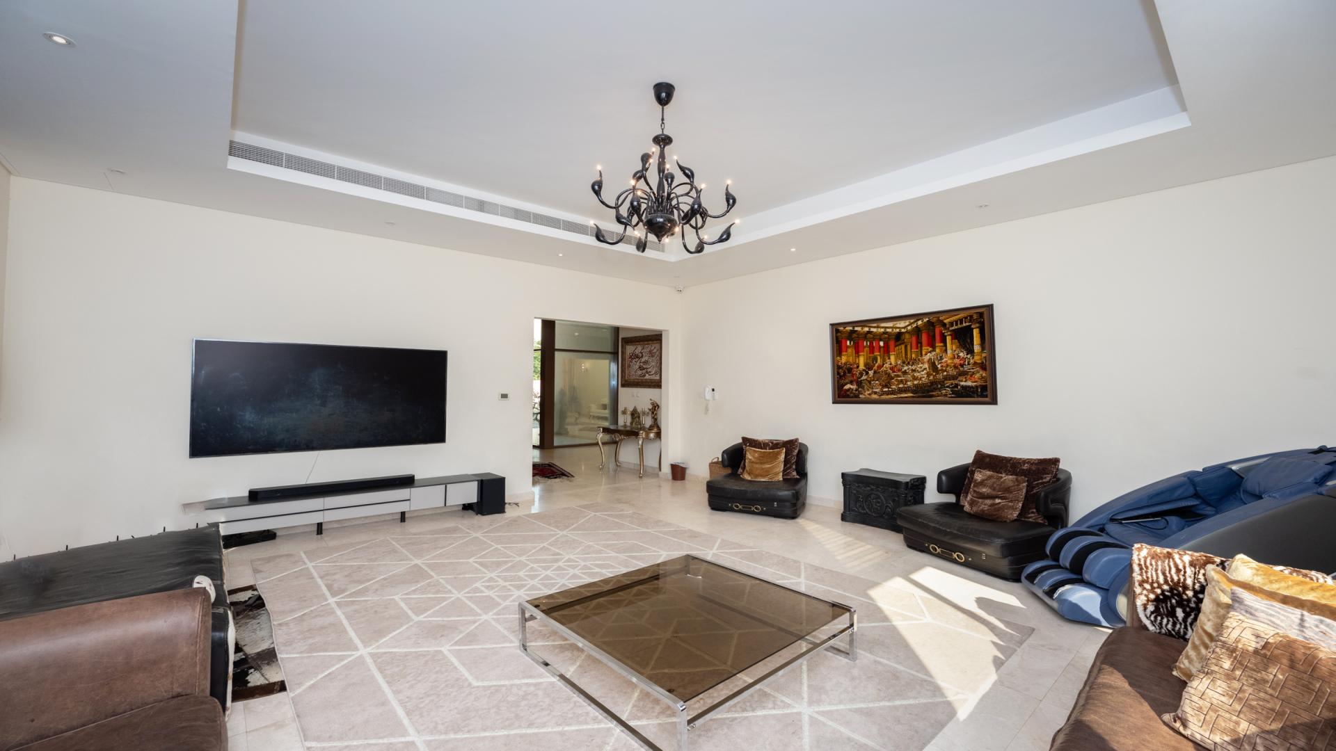 Elegant living room with chandelier in 5-bedroom Meydan villa, listing LP43702