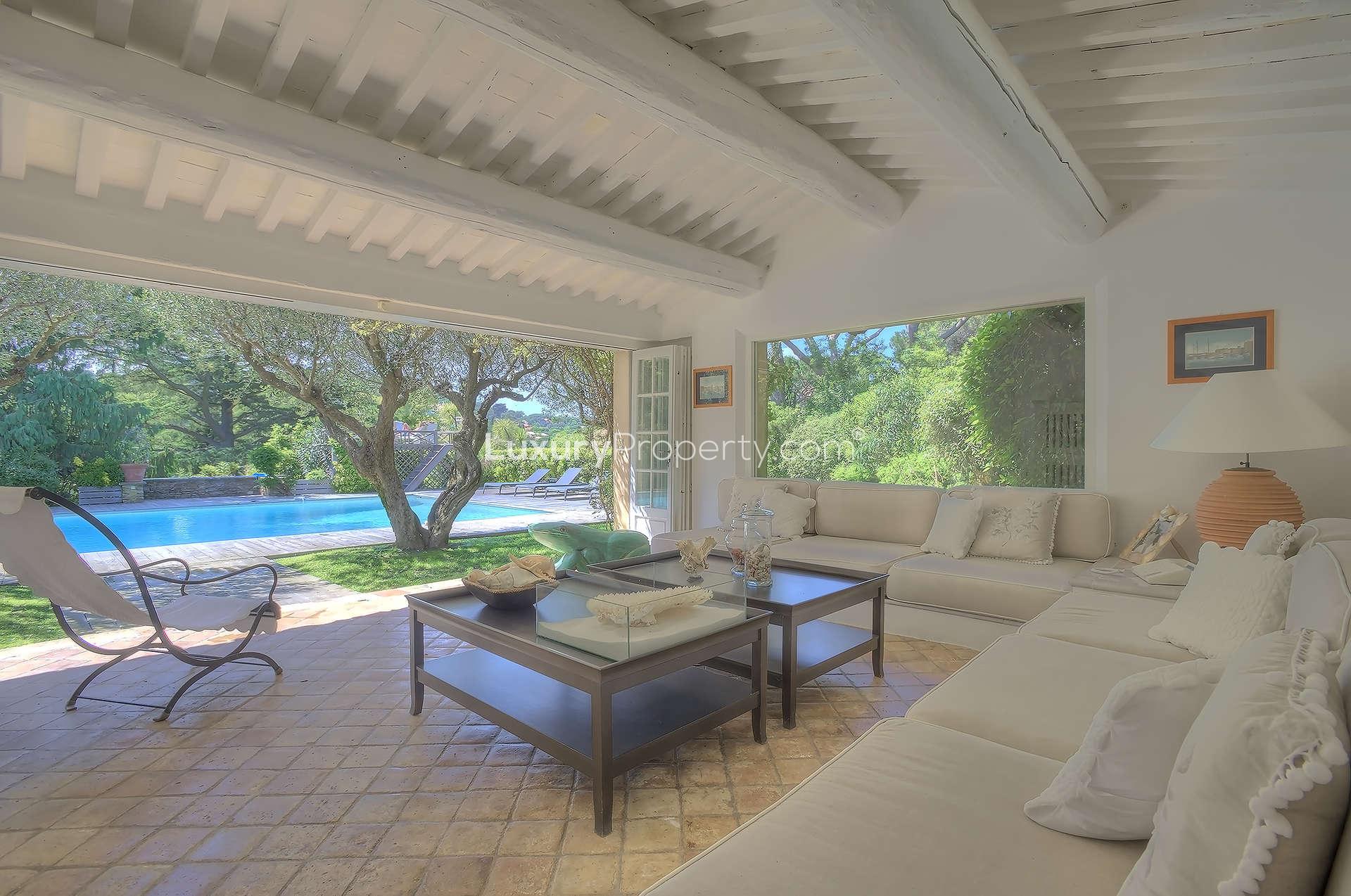 Living room of upgraded Provencal villa in Saint-Tropez, featuring elegant decor and natural light