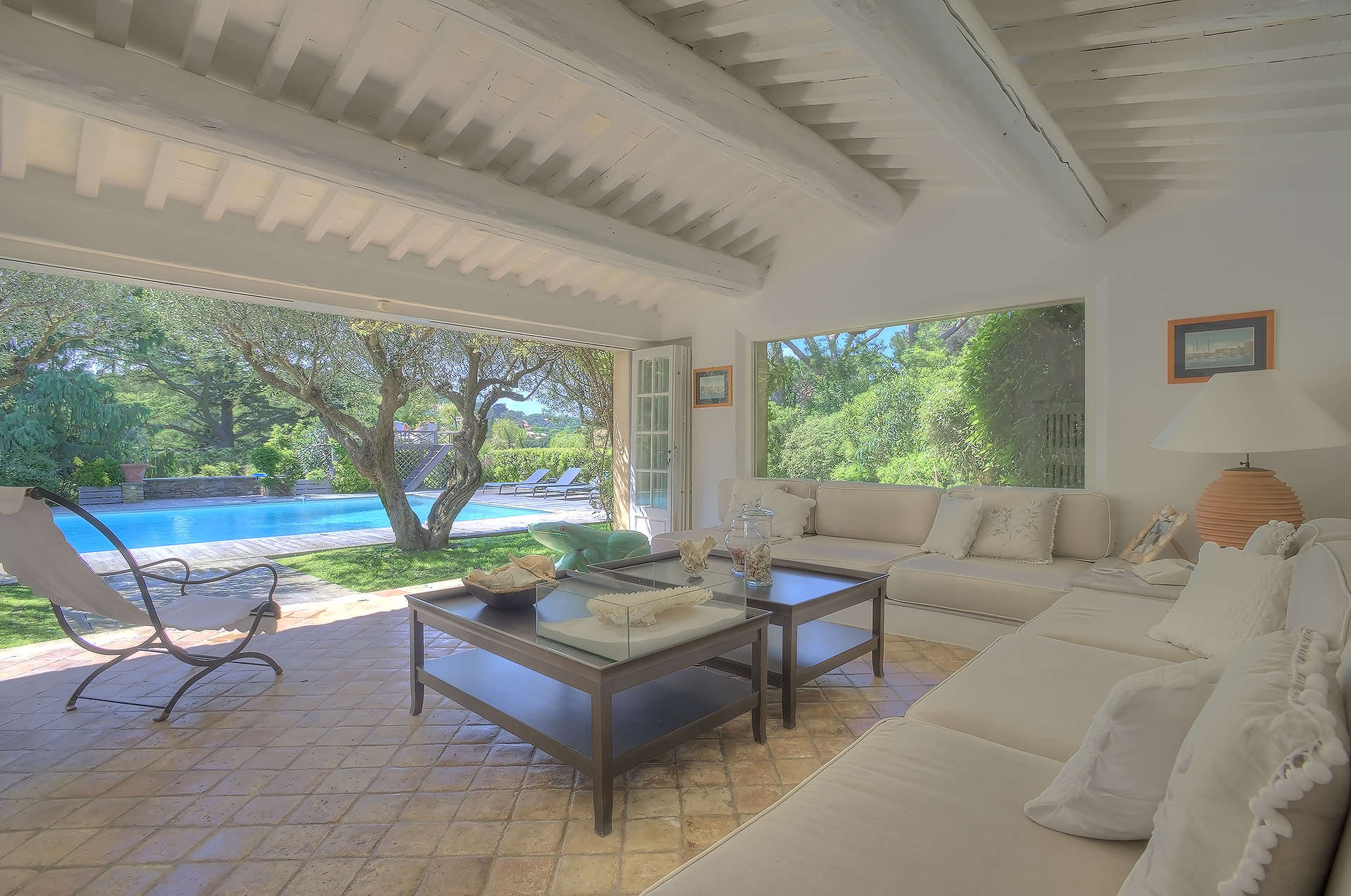 Living room of upgraded Provencal villa in Saint-Tropez, featuring elegant decor and natural light