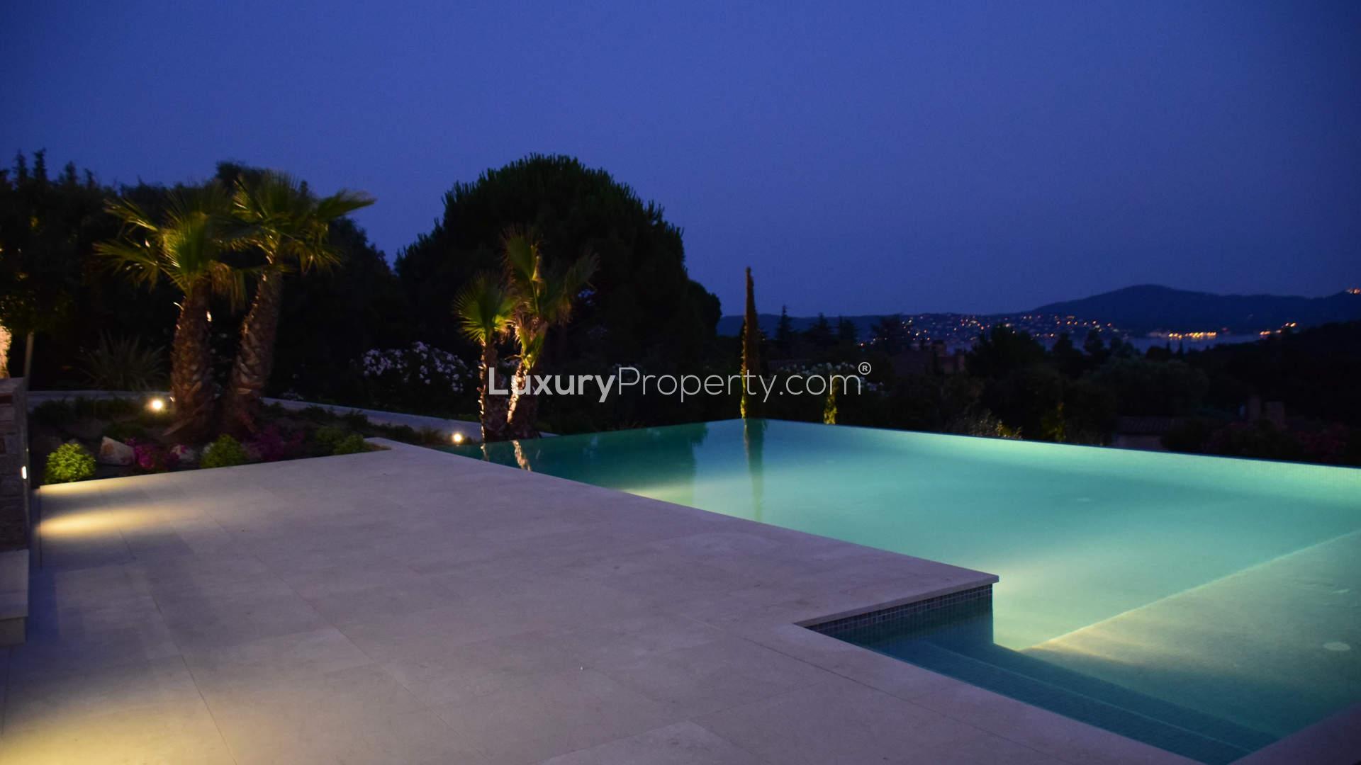 Luxurious villa entrance in Saint-Tropez, French Riviera, with modern lighting and garden