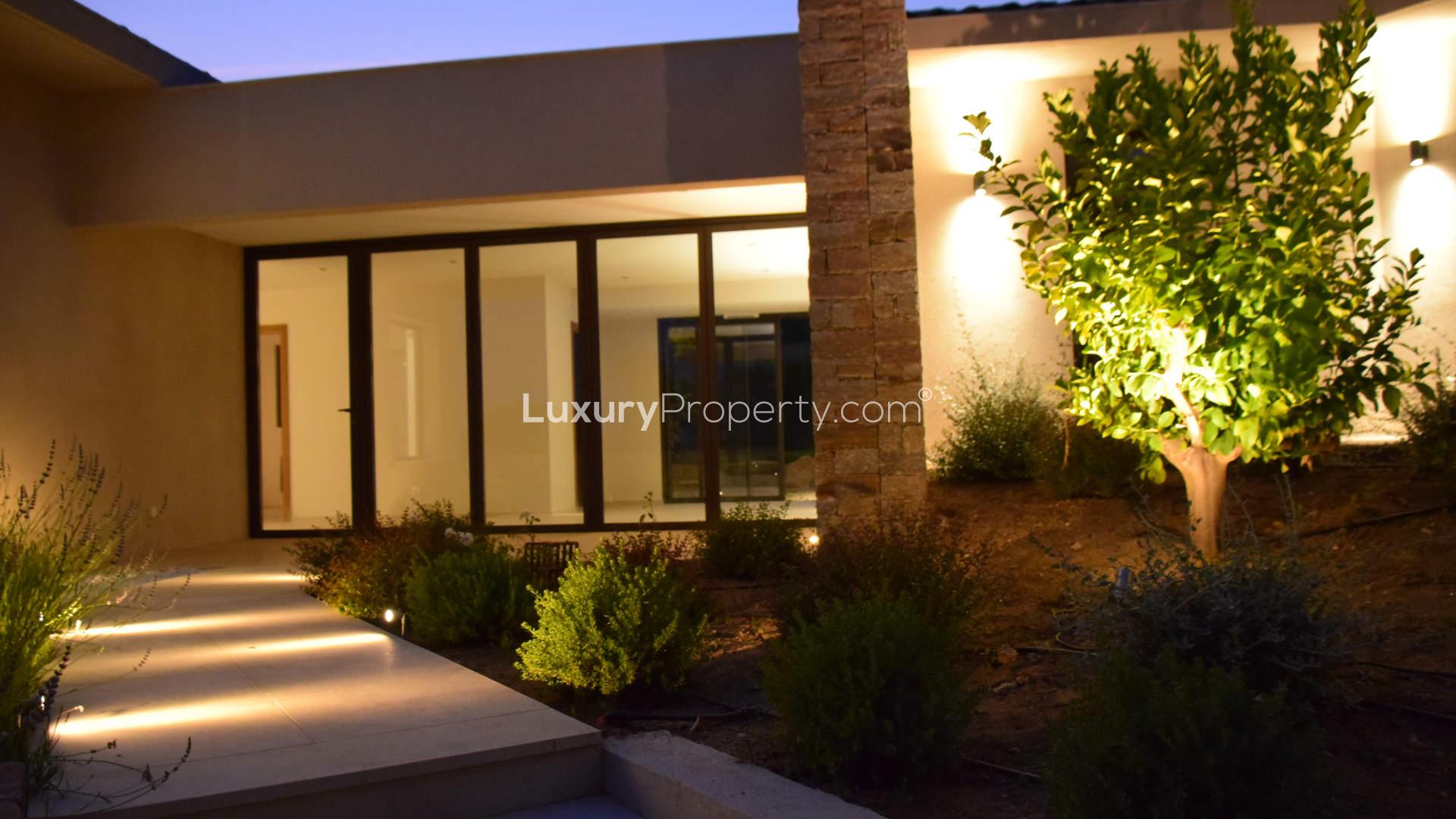 Luxurious Saint-Tropez villa pool with Gulf of St Tropez view at night