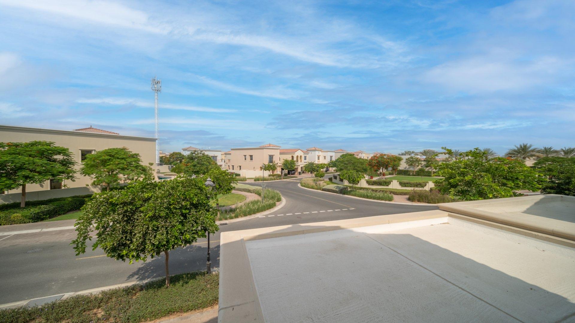 "Spacious living room in brand new Samara villa, Arabian Ranches 2, with patio view.","Scenic view of Samara community, Arabian Ranches 2, featuring modern villas and lush greenery.",Bright living room with large windows in Samara villa, Arabian Ranches 2, for sale